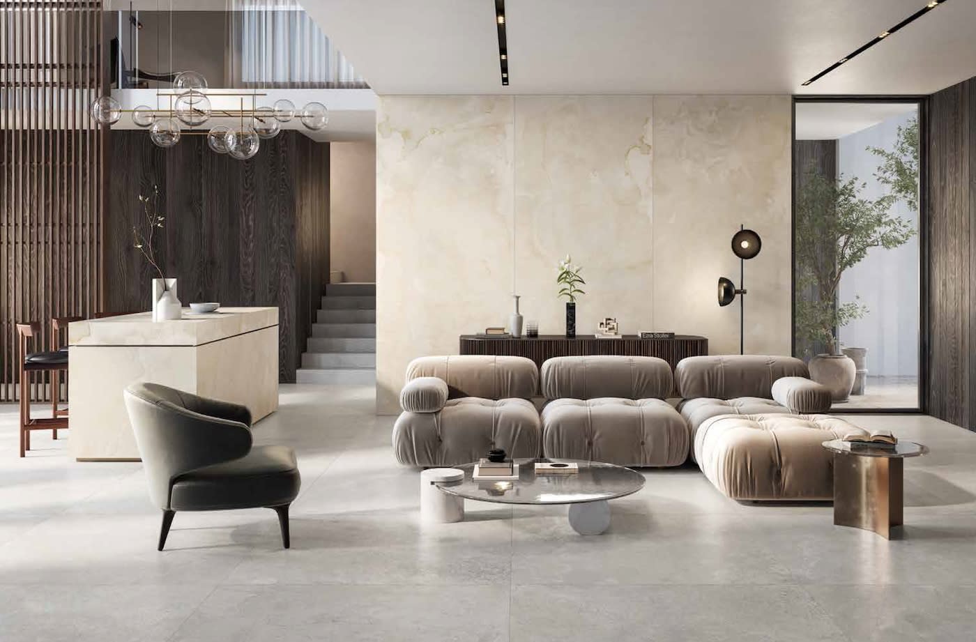 Modern living space with sleek, minimalist furniture. Features a plush, modular sofa, elegant chairs, a light wood table, and a large window with natural light.