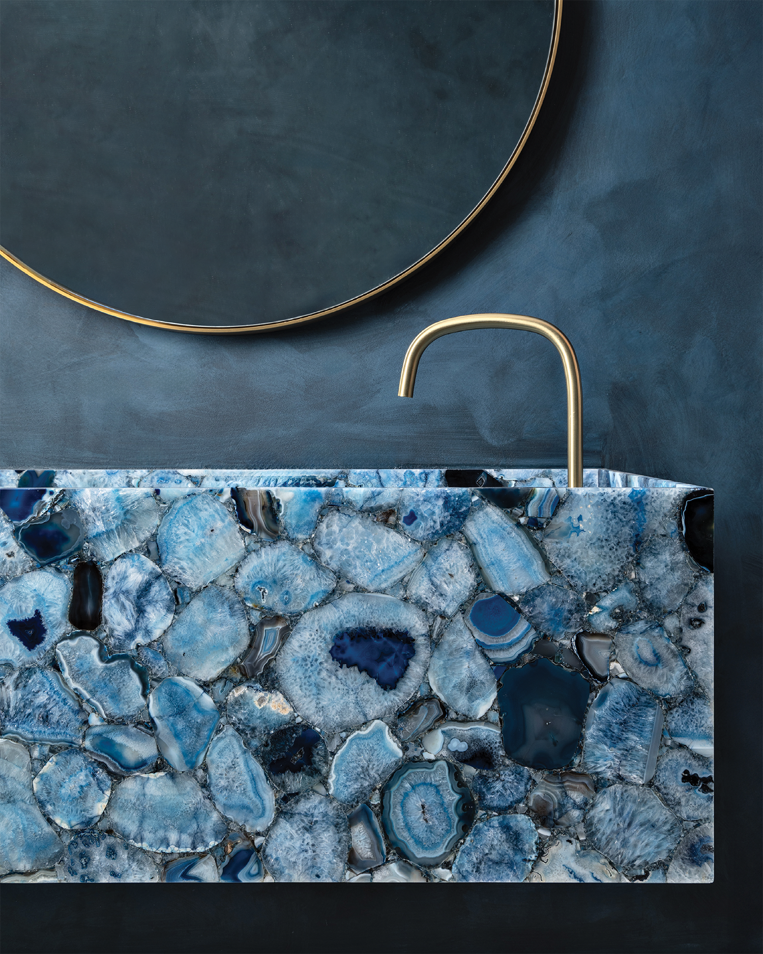 powder room with a blue agate vanity and matching blue walls