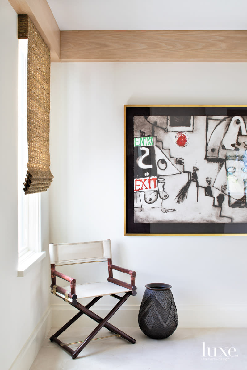 chair outside office with anton henning painting in home by Peter Moor