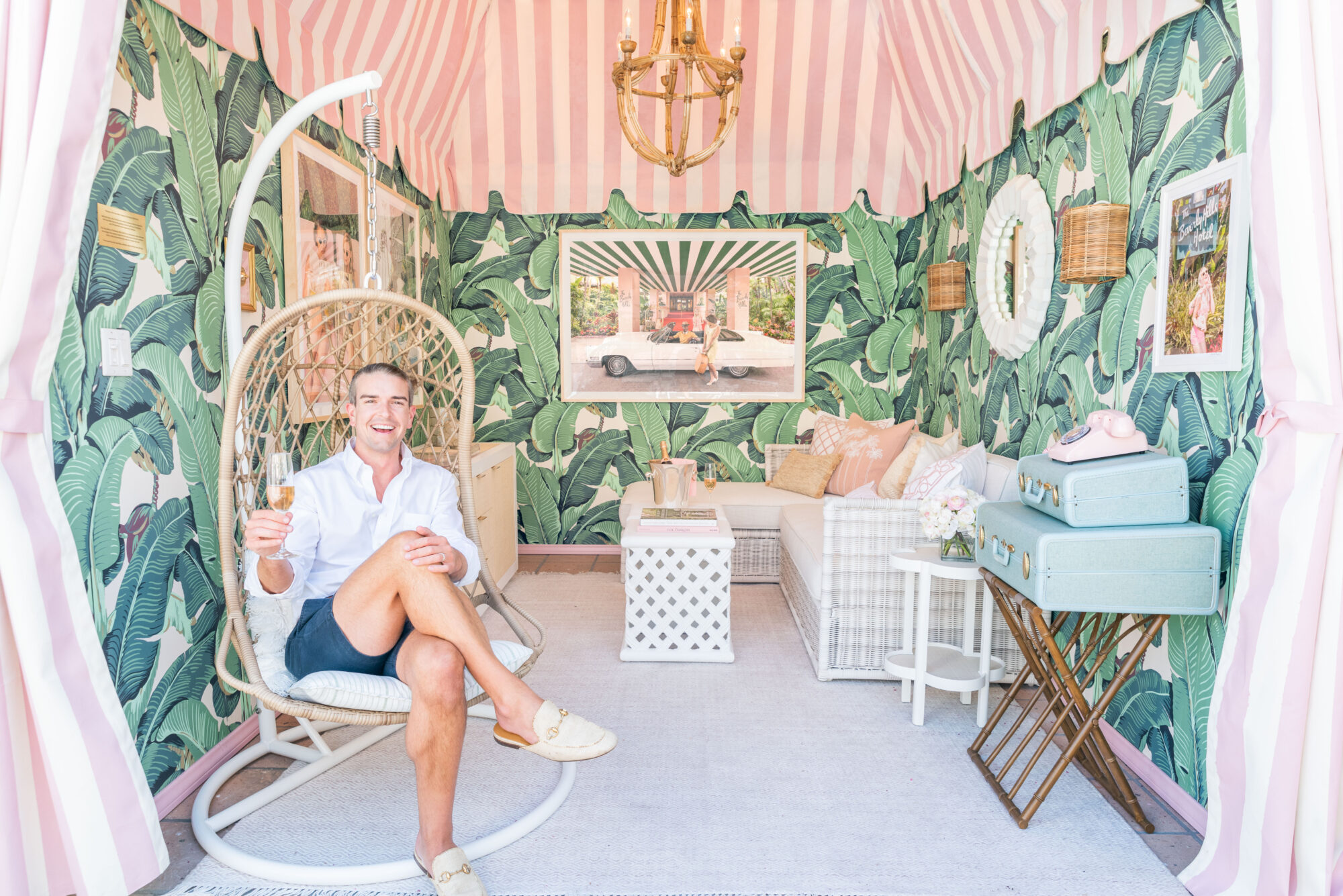 Gray Malin sits among his finished cabana