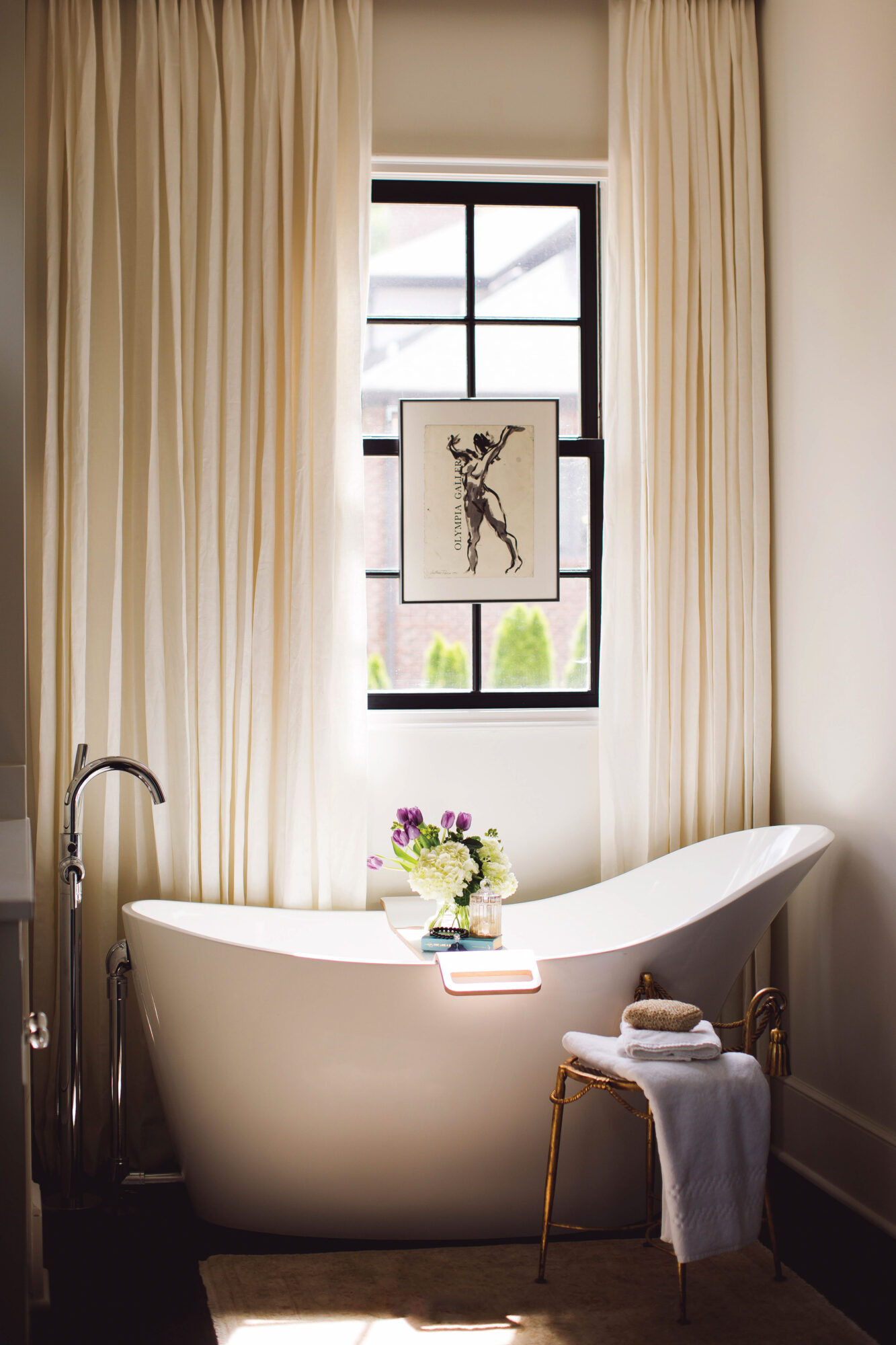 neutral bathroom with sculptural tub