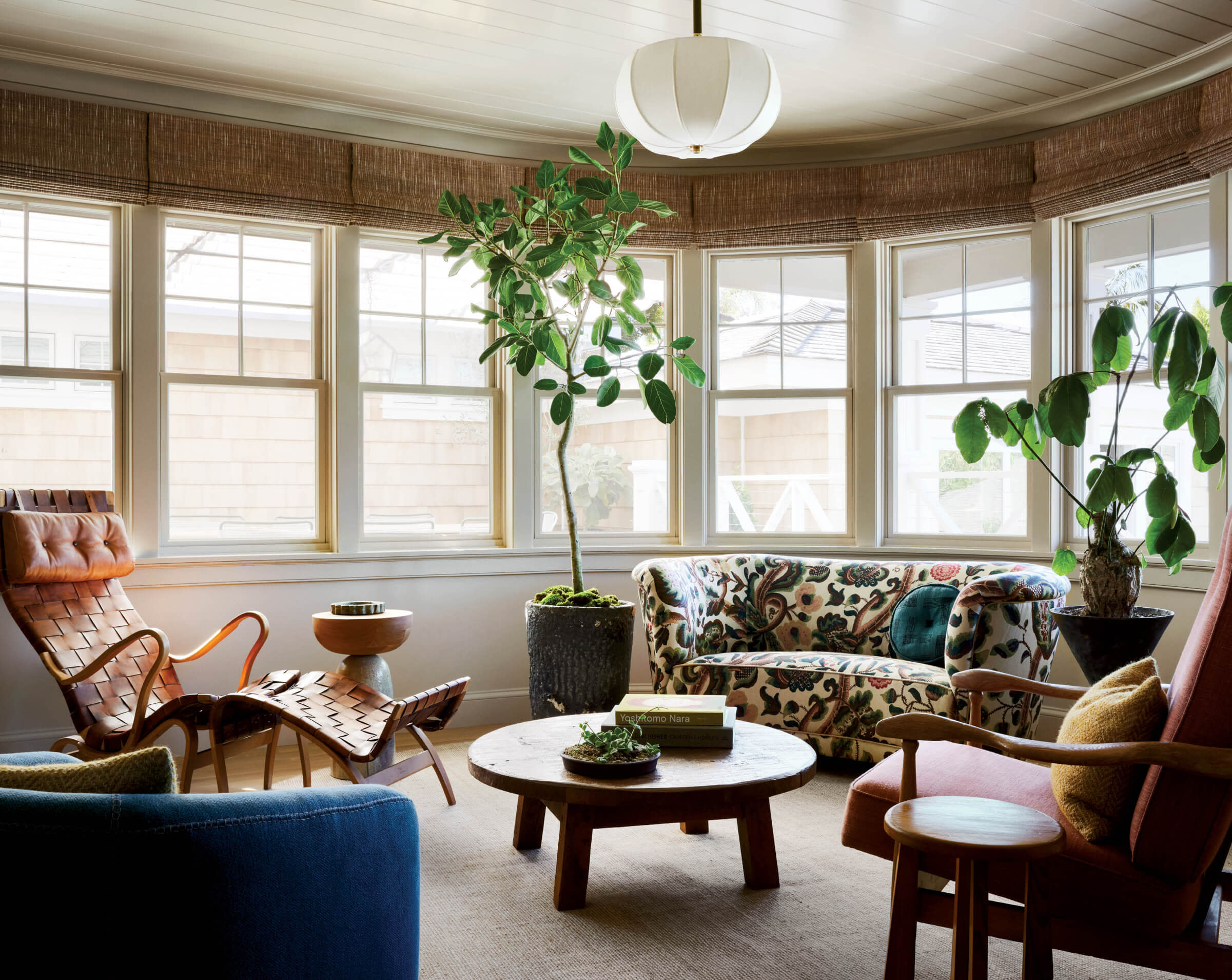 sun room with vintage Danish Cabinetmaker sofa and Stahl + Band swivel chair