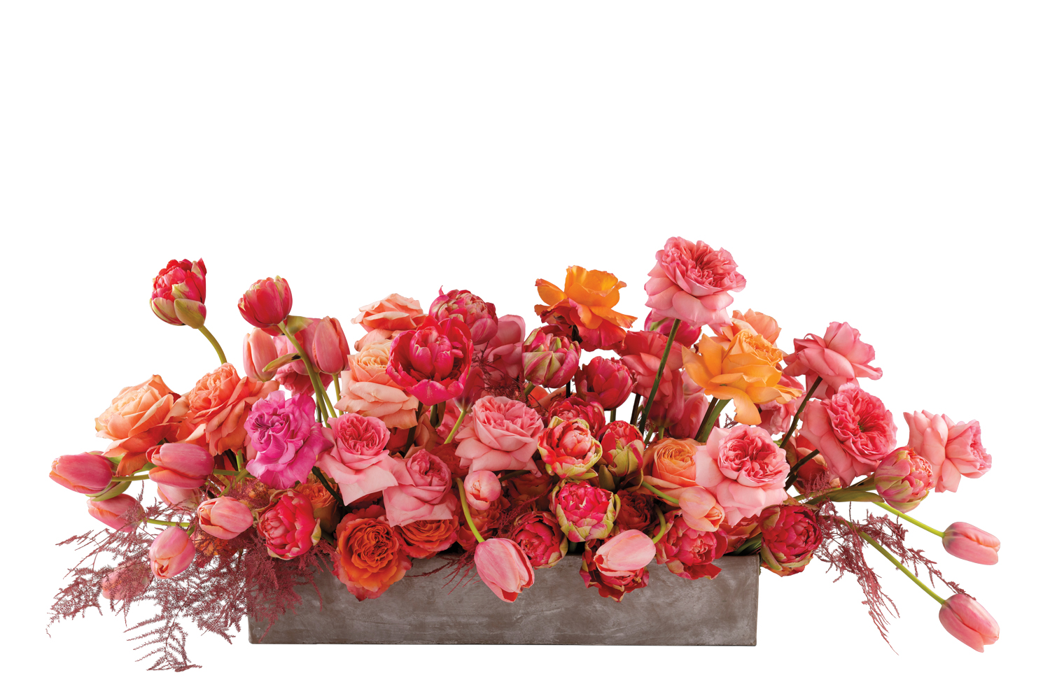 Vibrant flower arrangement in a low-profile rectangular concrete vase by Shane Friesenhahn