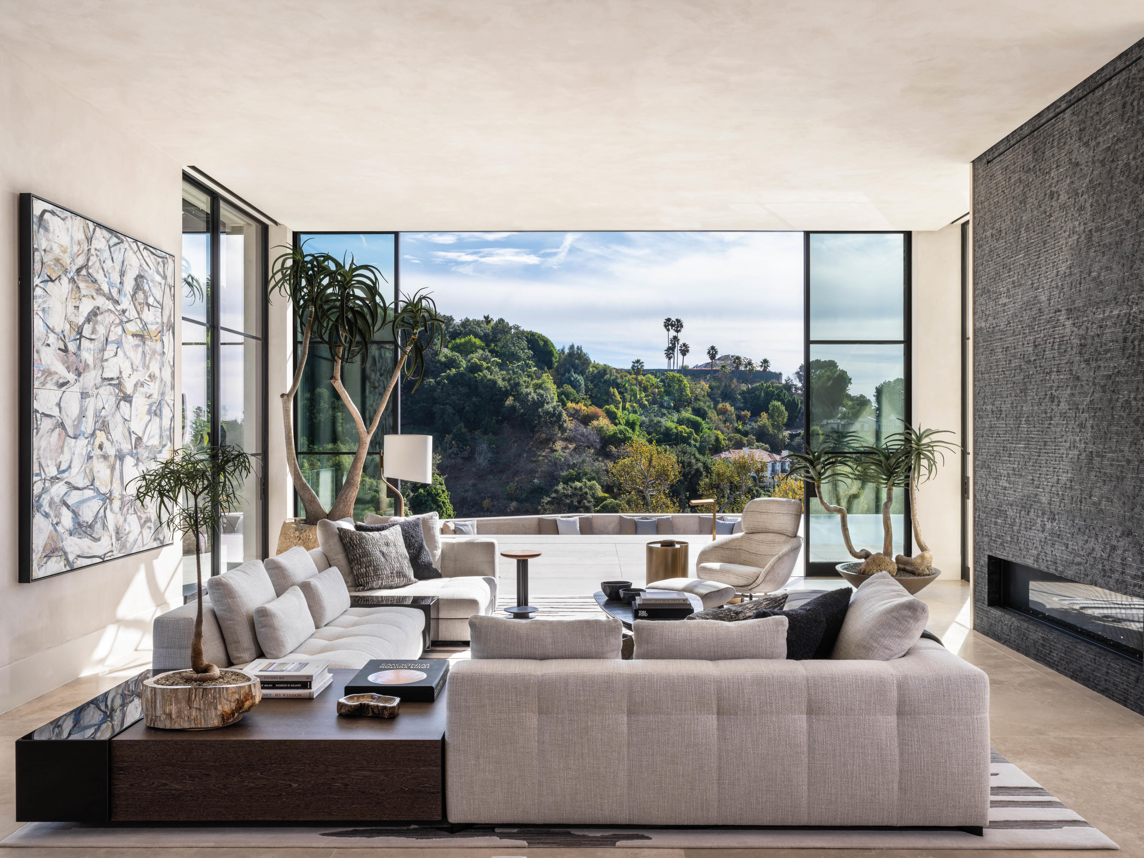 gray living room with floor-to-ceiling windows opens to pool deck