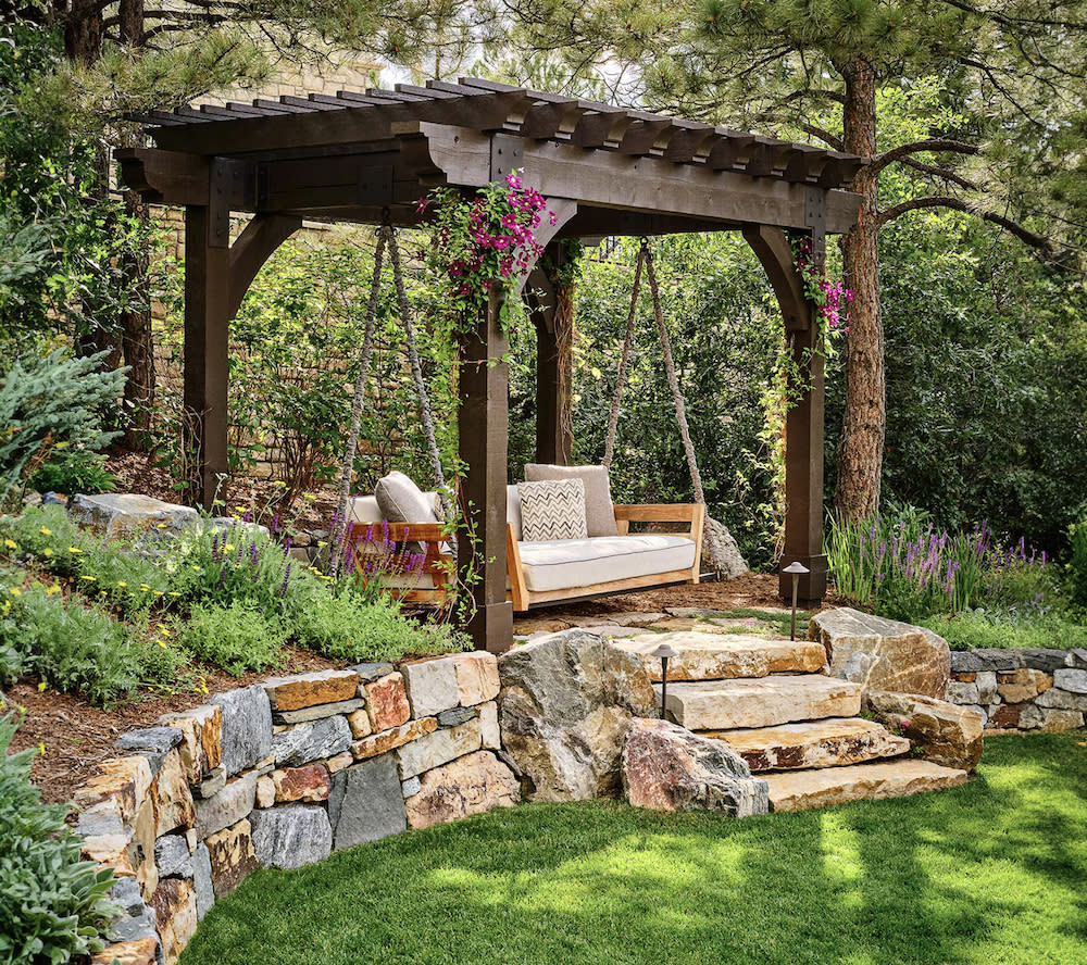 Relaxing garden setting with swing, bench, and gazebo.