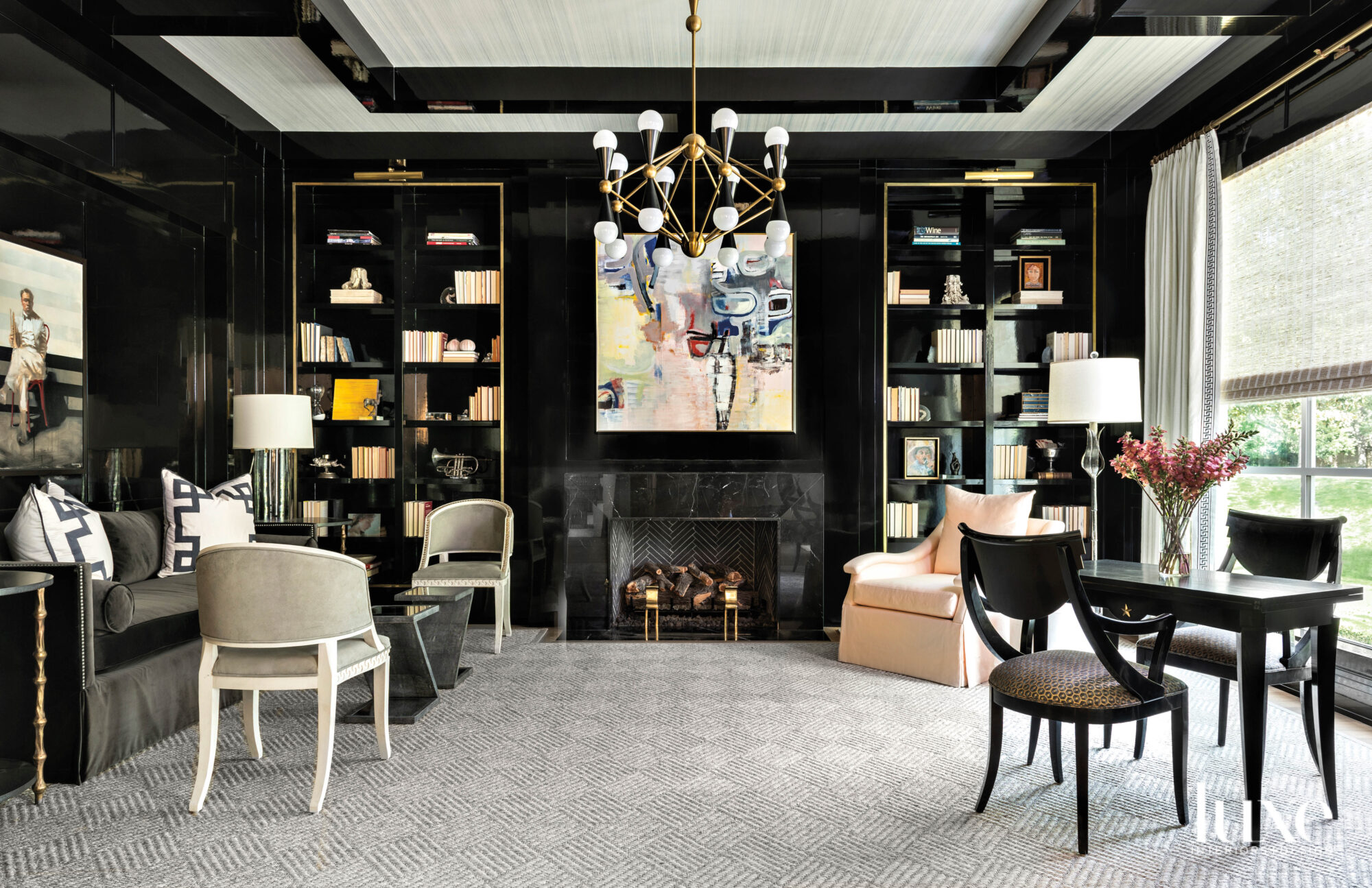 Library featuring a marble fireplace and walls lacquered in black paint by Fine Paints of Europe