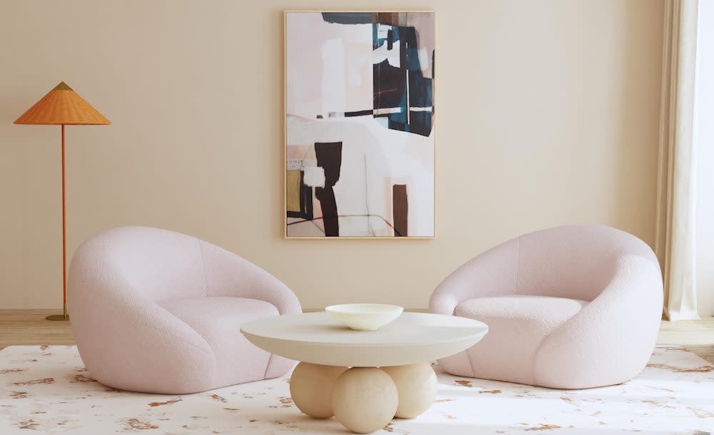 off-white room with two modern white chairs and light wood table