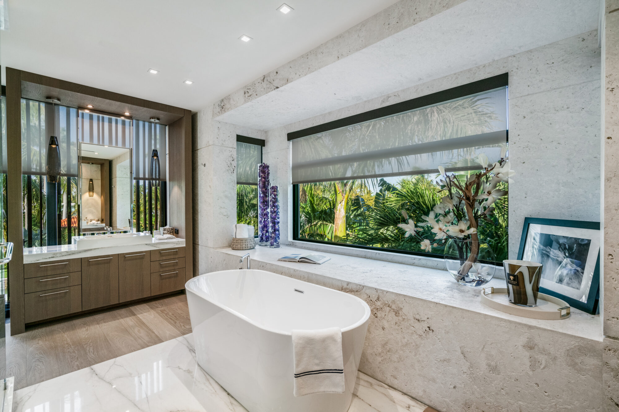 bathroom with freestanding tub and natural stone surfaces in 