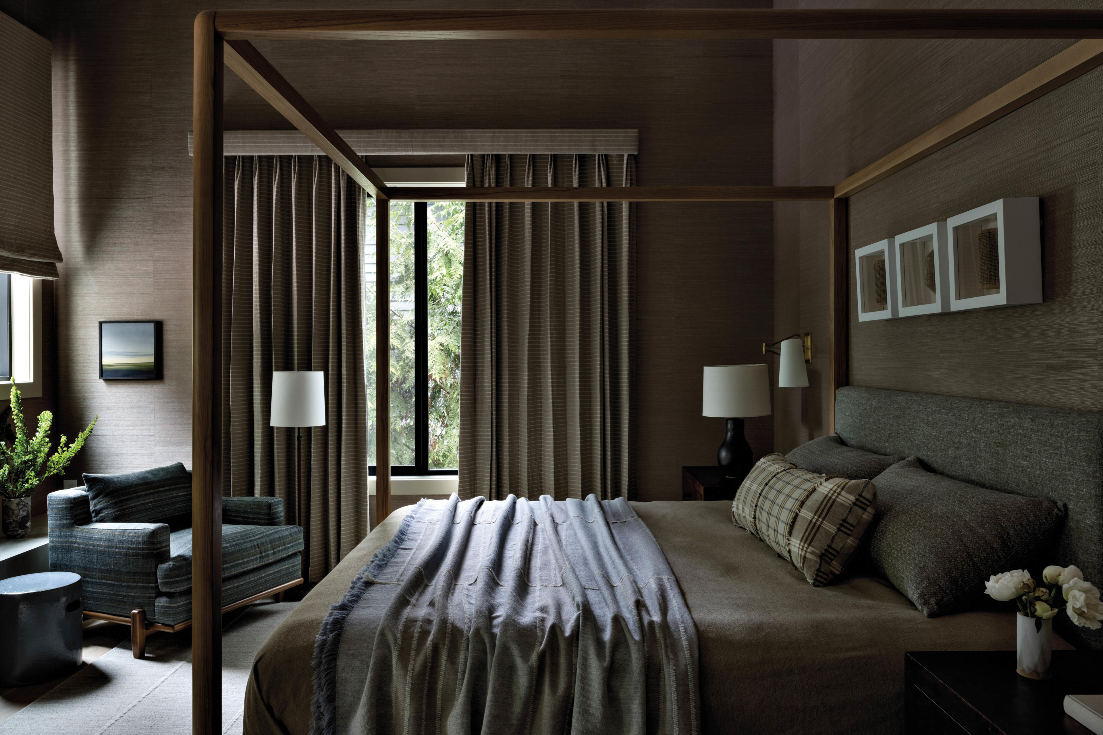 dark and moody bedroom with grey and green bedding