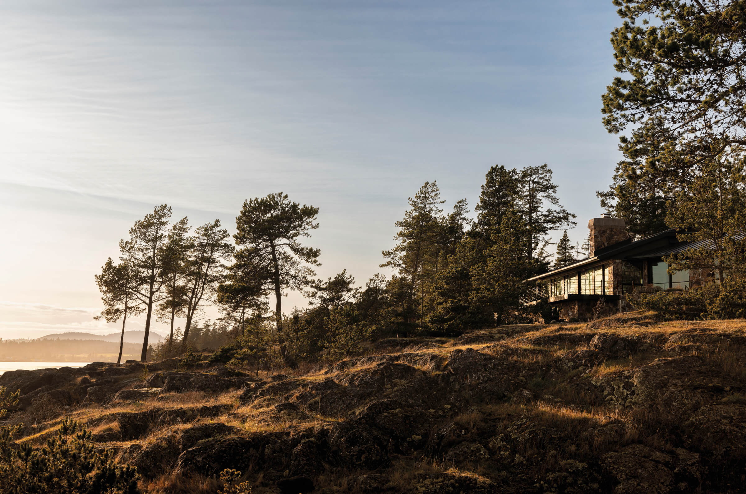 San Juan Island home exterior on rocky hillside 
