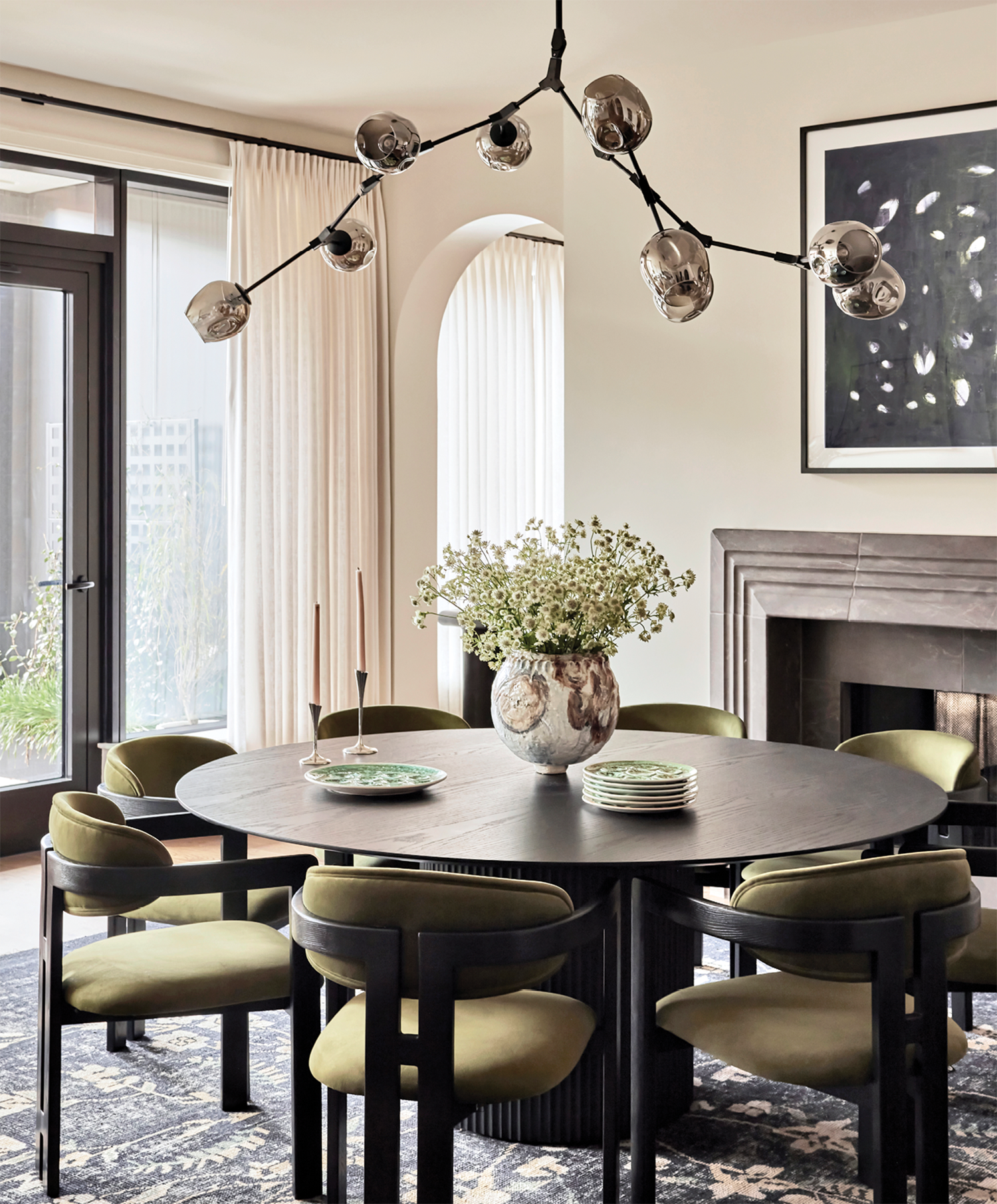 dining room with a modern Jas Boutique fixture above an RH table