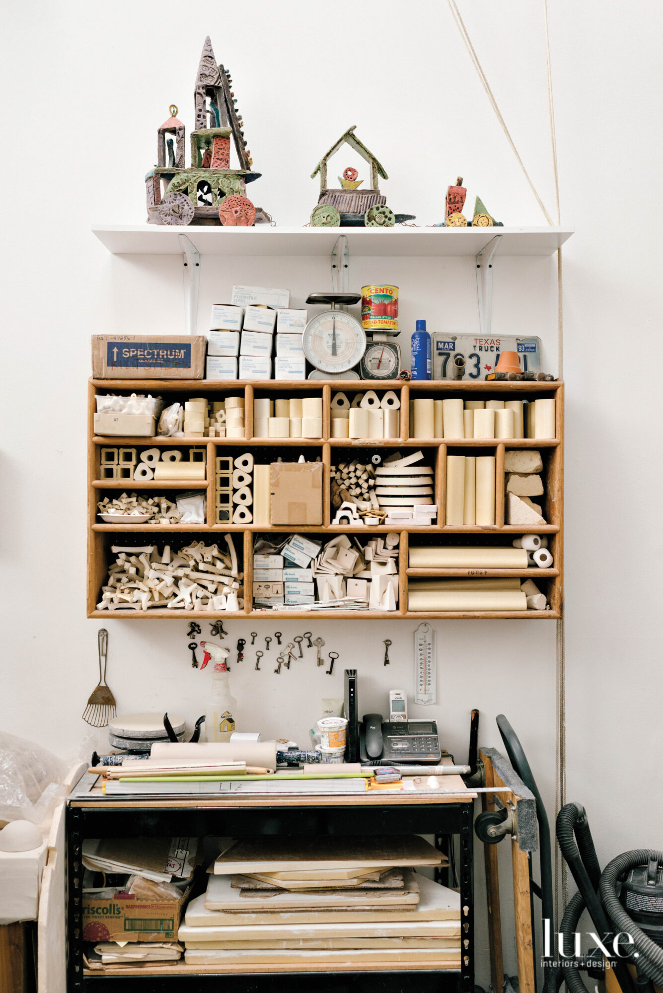 Shelves are filled with raw materials and works in progress