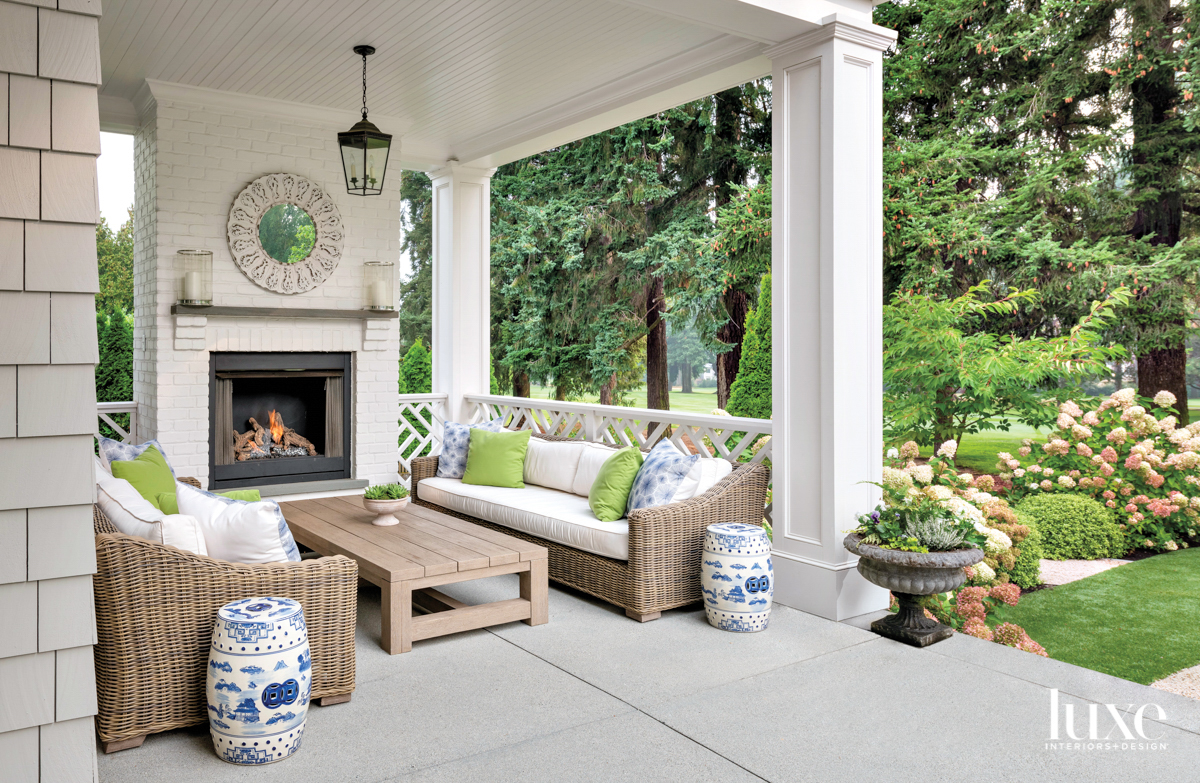 Covered outdoor room with fireplace and seating