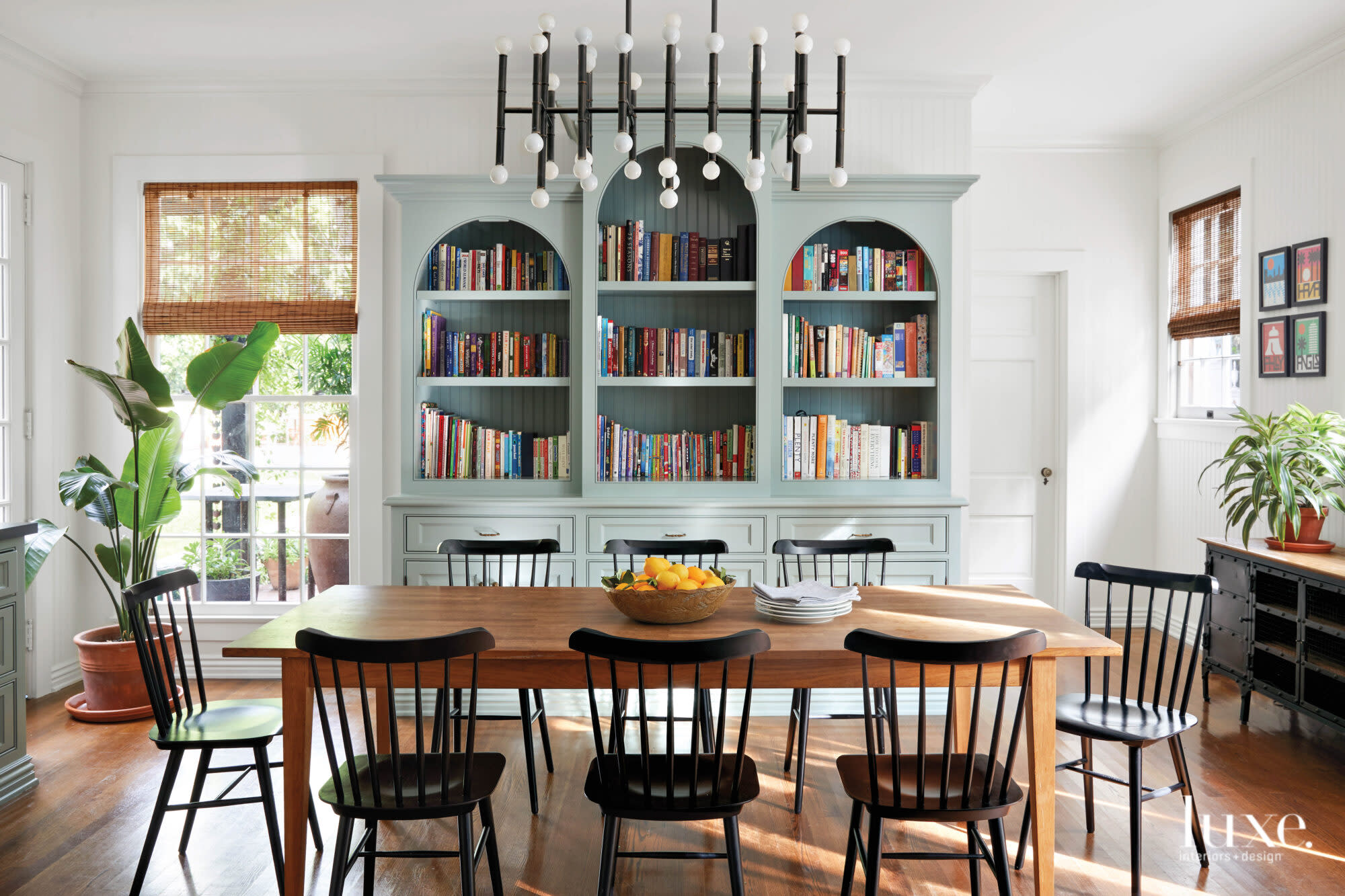Eat in kitchen facing a filled, blue bookshelf.