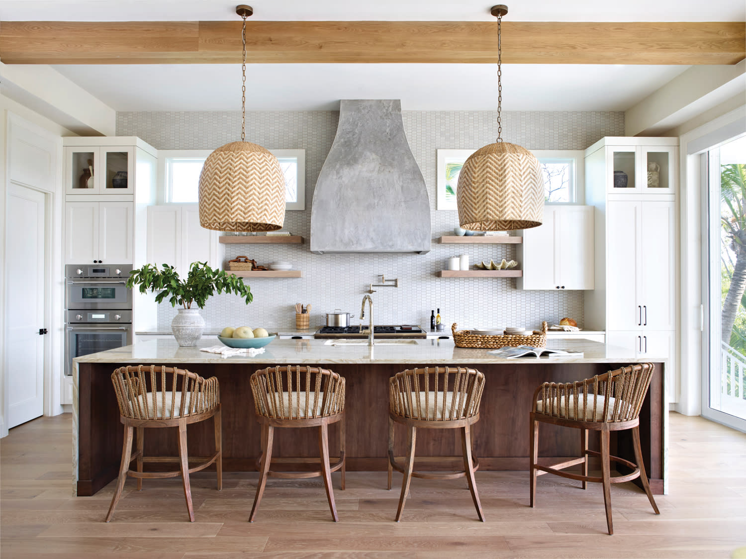 coastal kitchen with a waterfall island and decorative beams