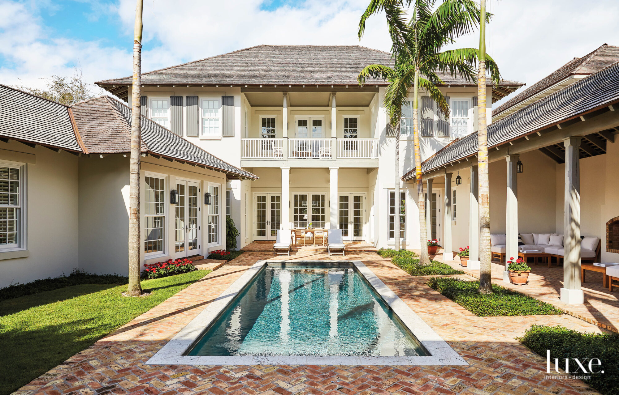 Courtyard with pool, lounge area and dining space.