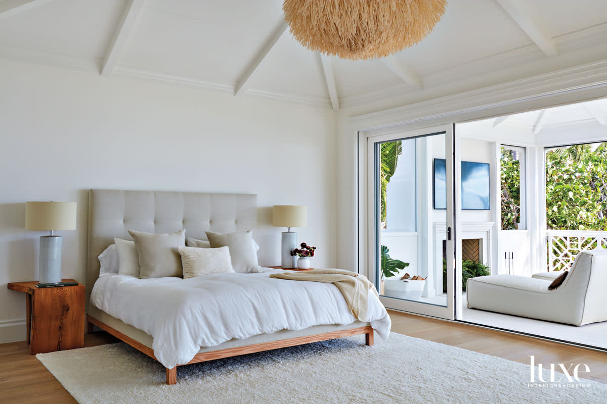 White bedroom with sea urchin-style chandelier