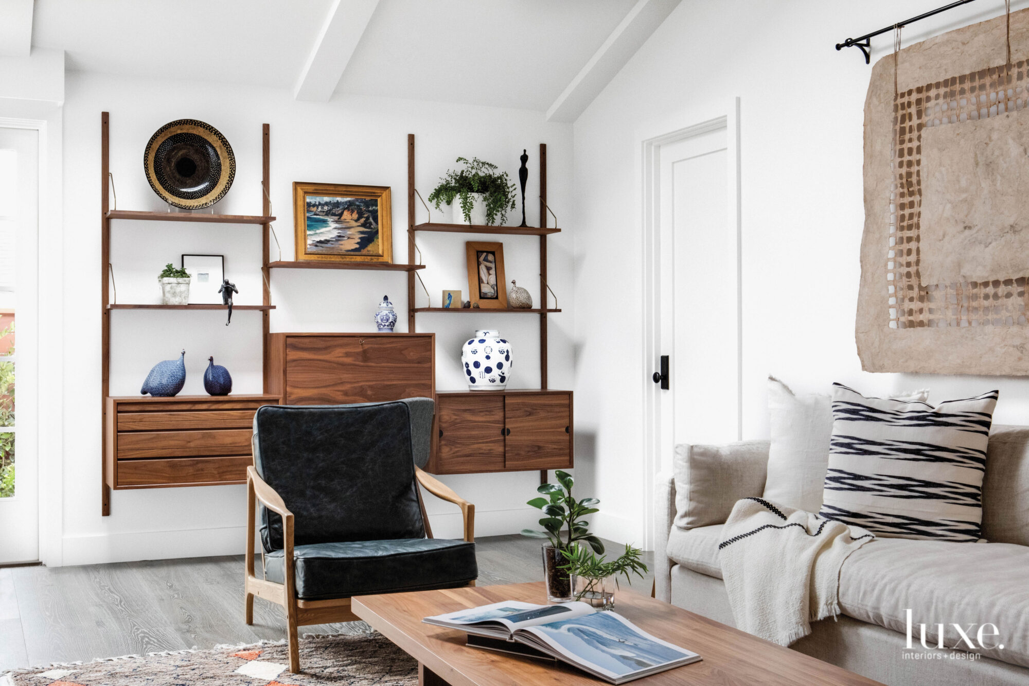 Study with shelving unit and armchair