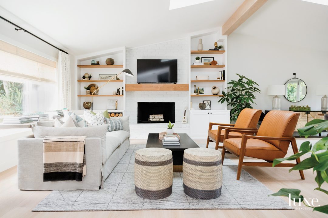 living room with open shelving by fireplace