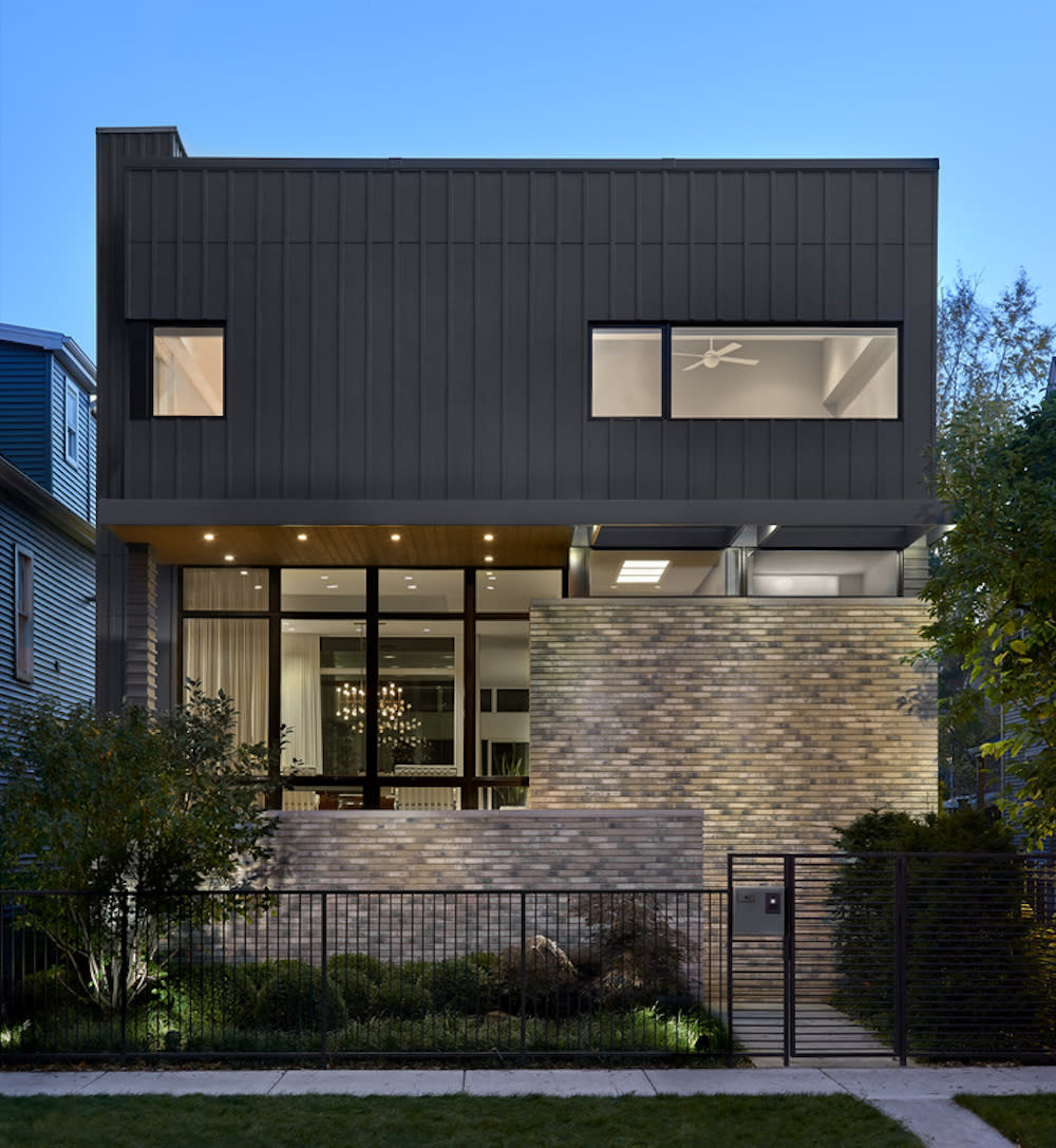 Front exterior with brick entry and generous front porch space