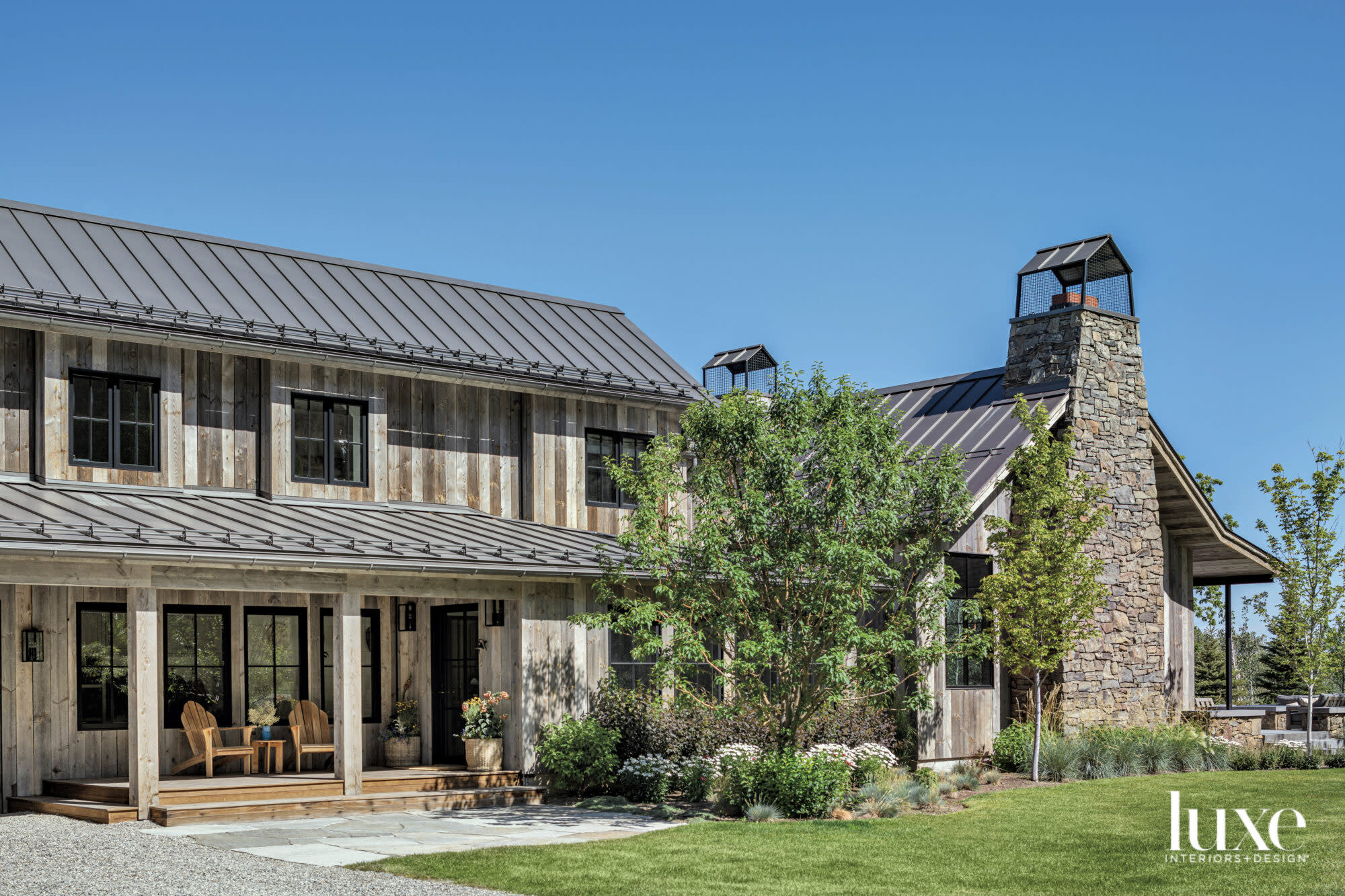 Front exterior with fieldstone chimney