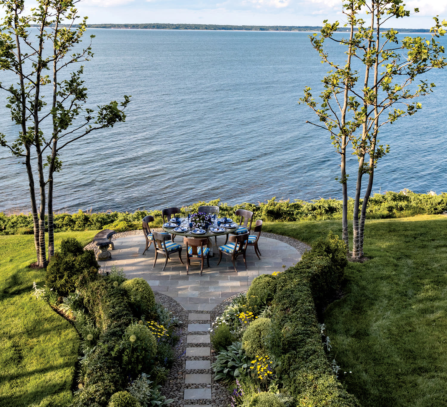 circular patio of a Hamptons home overlooking the water
