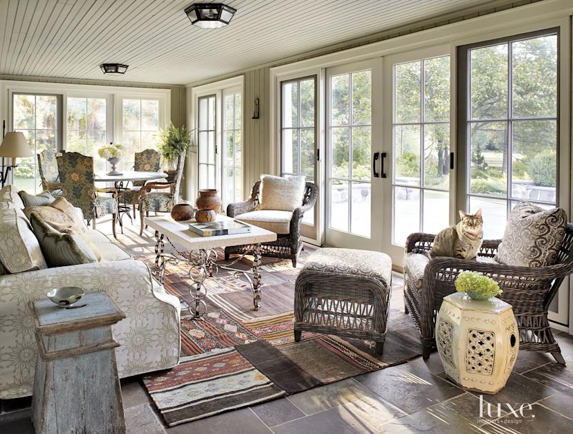 Transitional Neutral Sunroom with Kilim Rug Luxe Interiors + Design