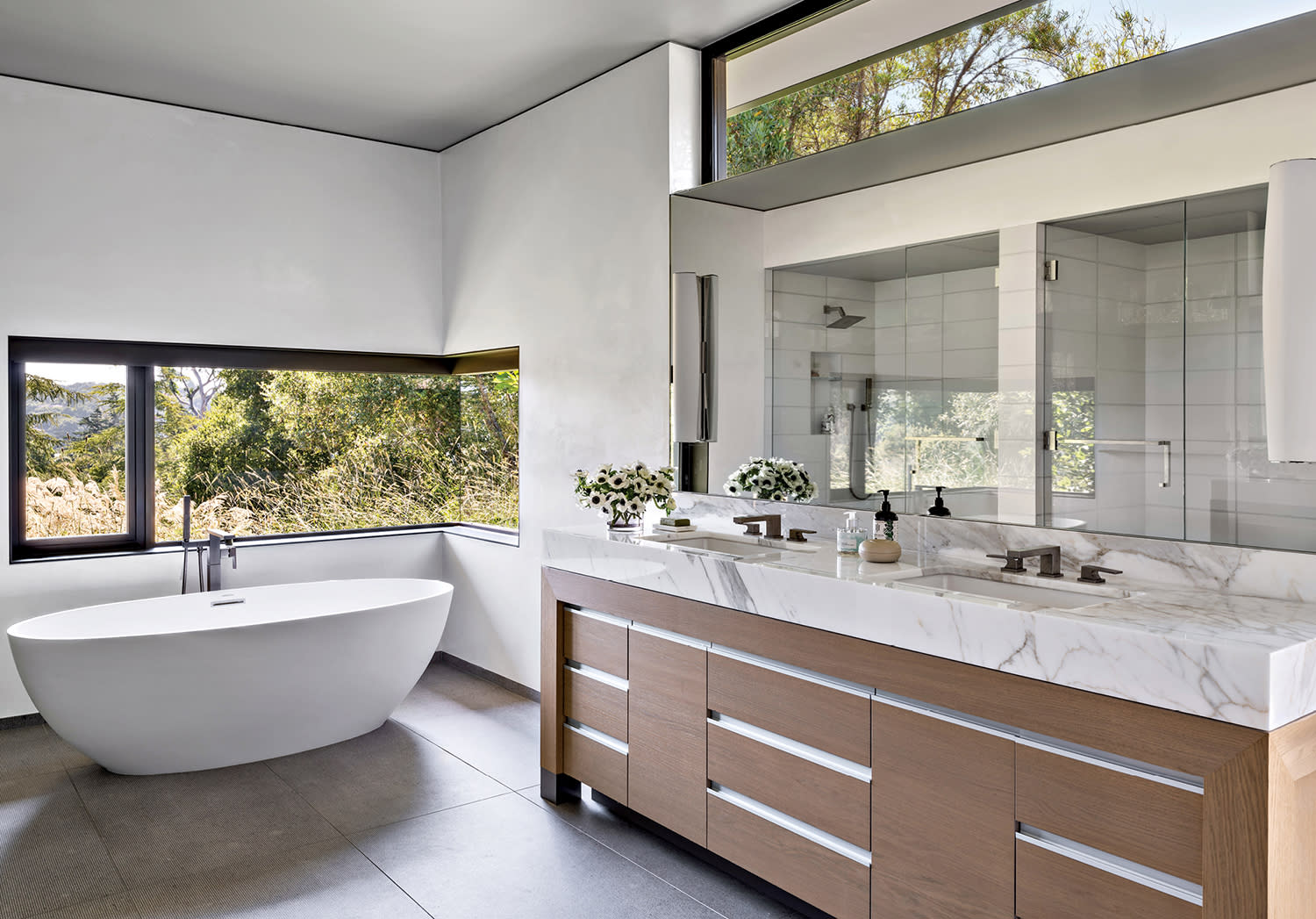 luxury bathroom with a double vanity topped by Calacatta marble 