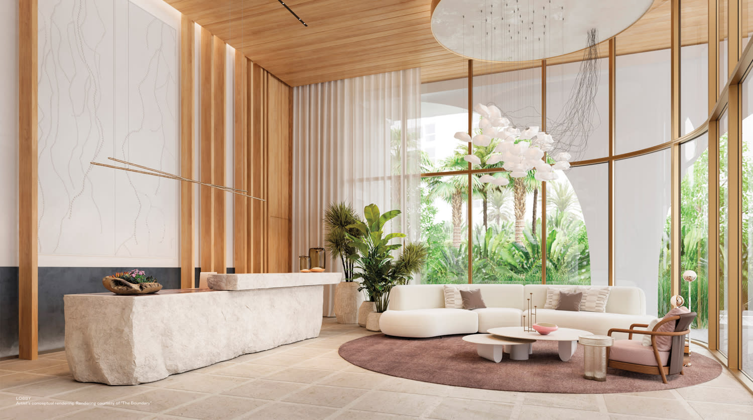 Lobby with curved floor-to-ceiling windows on one side and a large-scale live edge stone counter on the other.