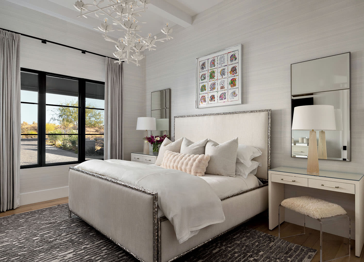 serene guest bedroom topped with a floral Visual Comfort & Co. chandelier