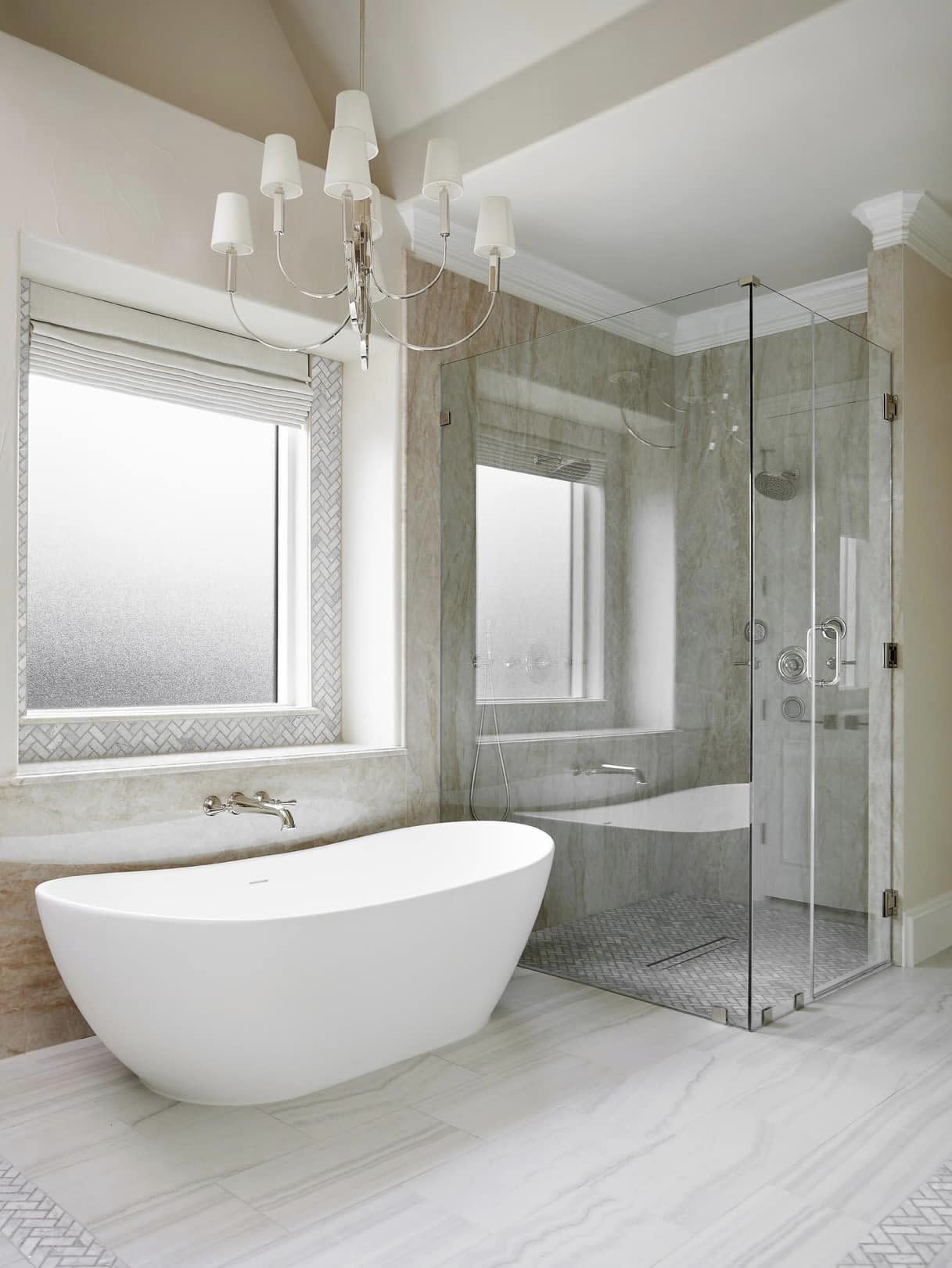 A spacious bathroom with a large bathtub and separate shower.