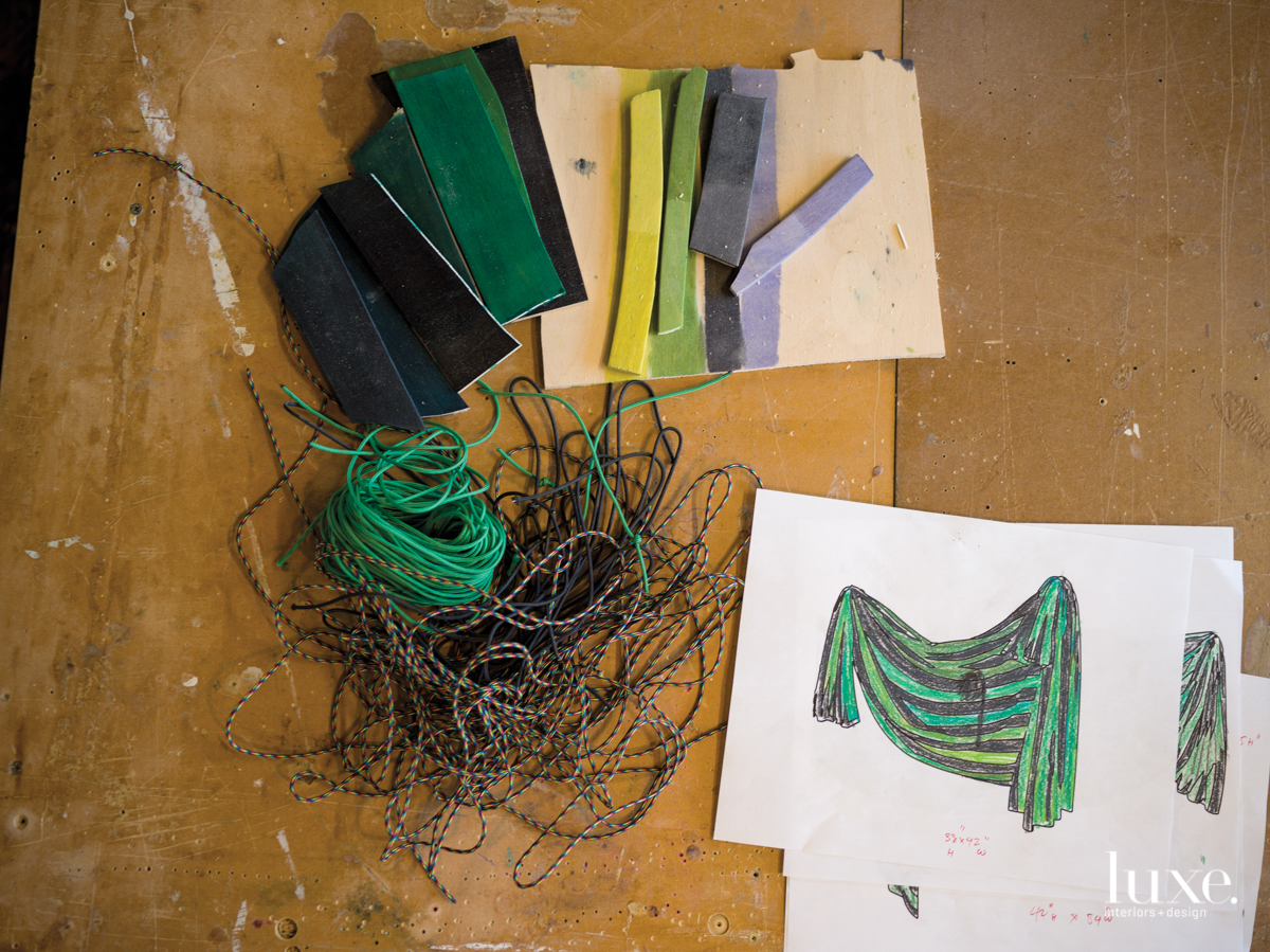Small-gauge rope, pieces of plywood and a sketch sit on Dan Gunn's table.