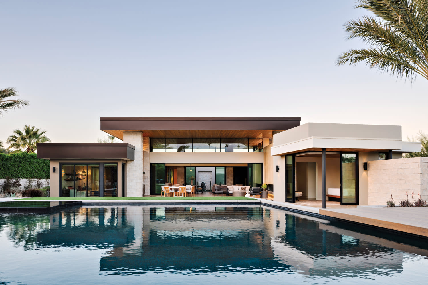 contemporary backyard of a luxury home with a pool