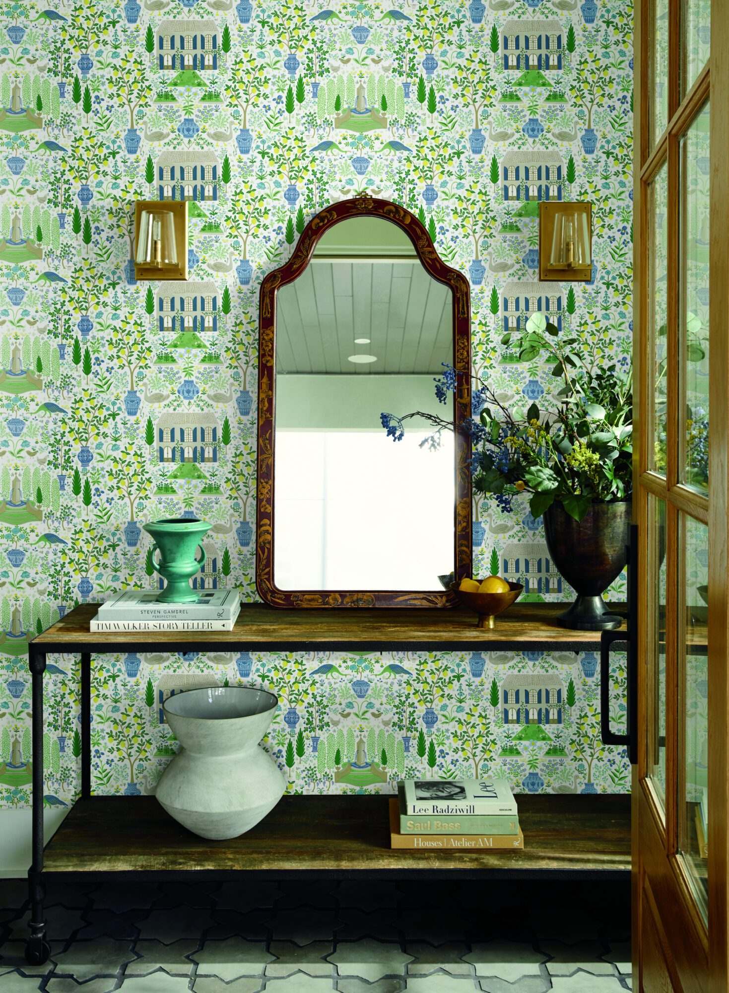 green tones wallpaper mirror books on table