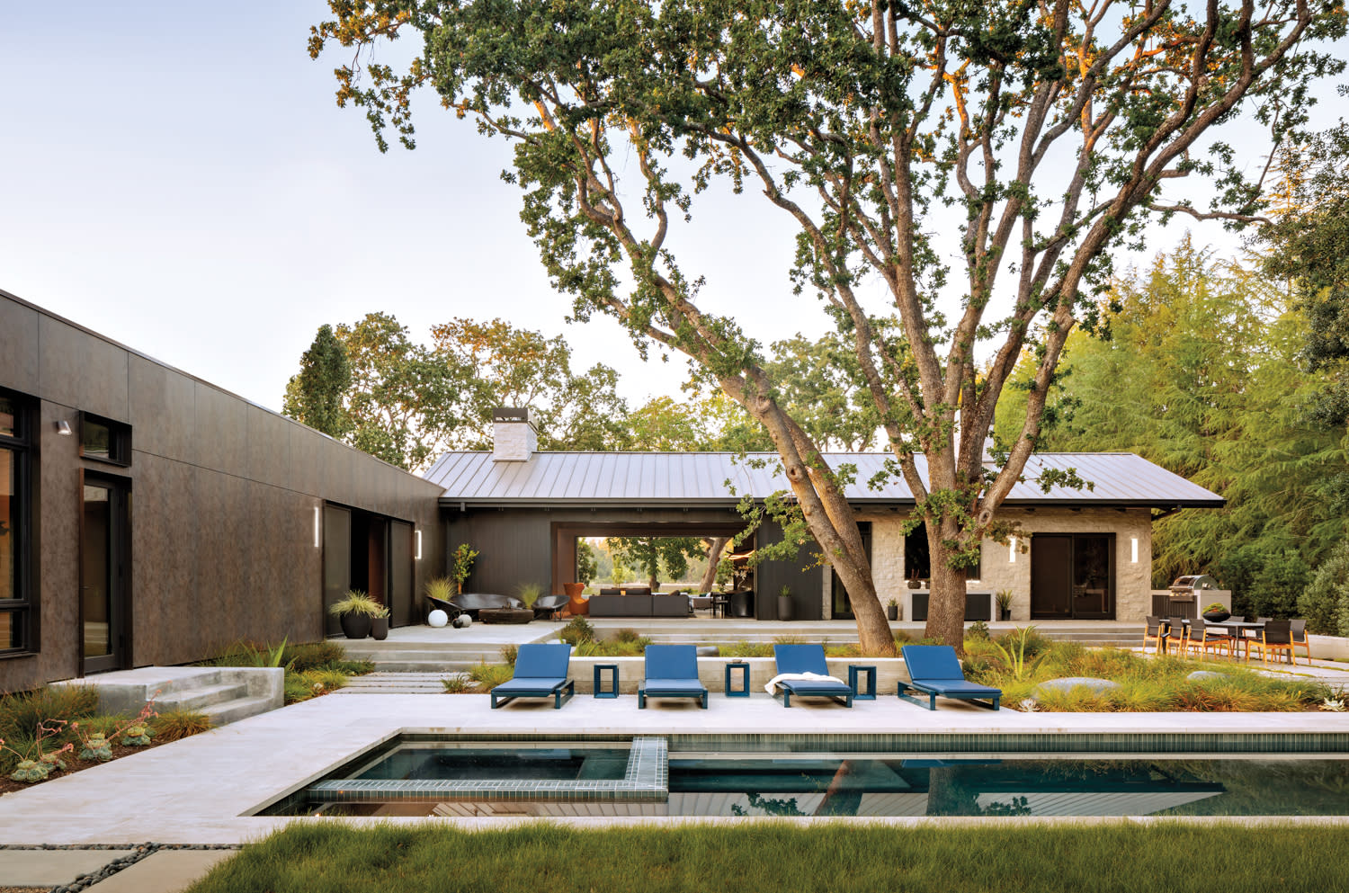 the garden of this Napa Valley home features a pool and lounge chairs