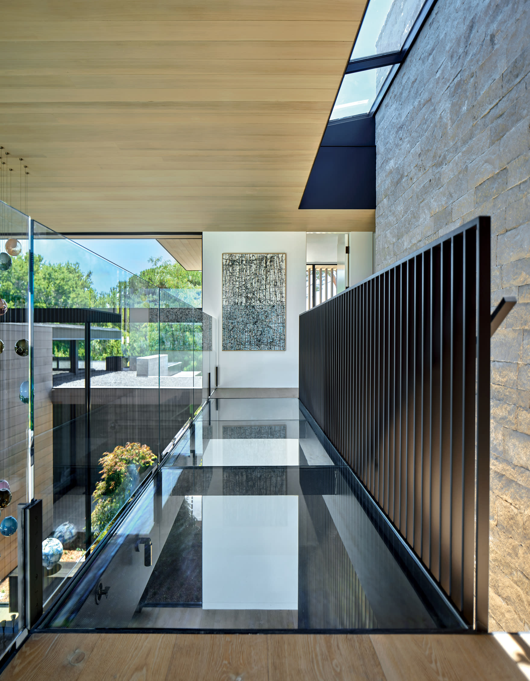 glass walkway between the primary suite and the bedroom 