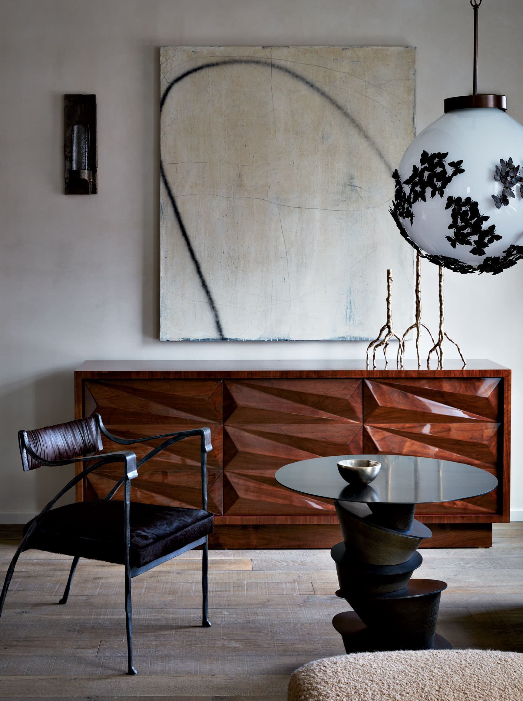 modern showroom with a large pendant light above a coffee table