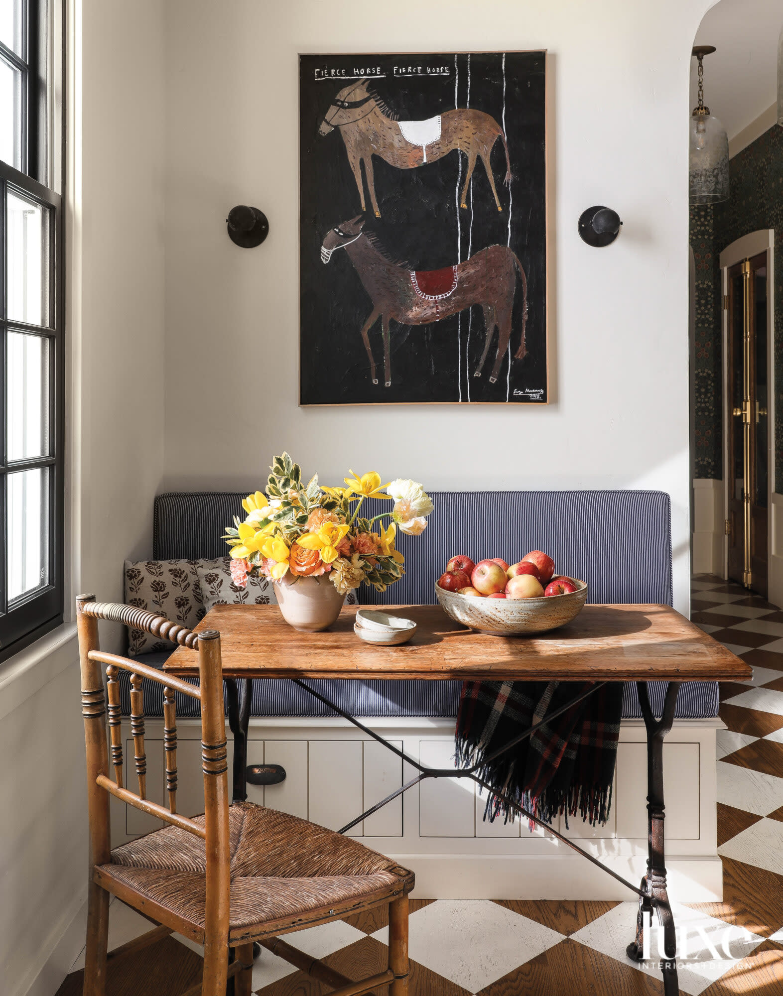 A small banquette in the kitchen is a place to eat breakfast.
