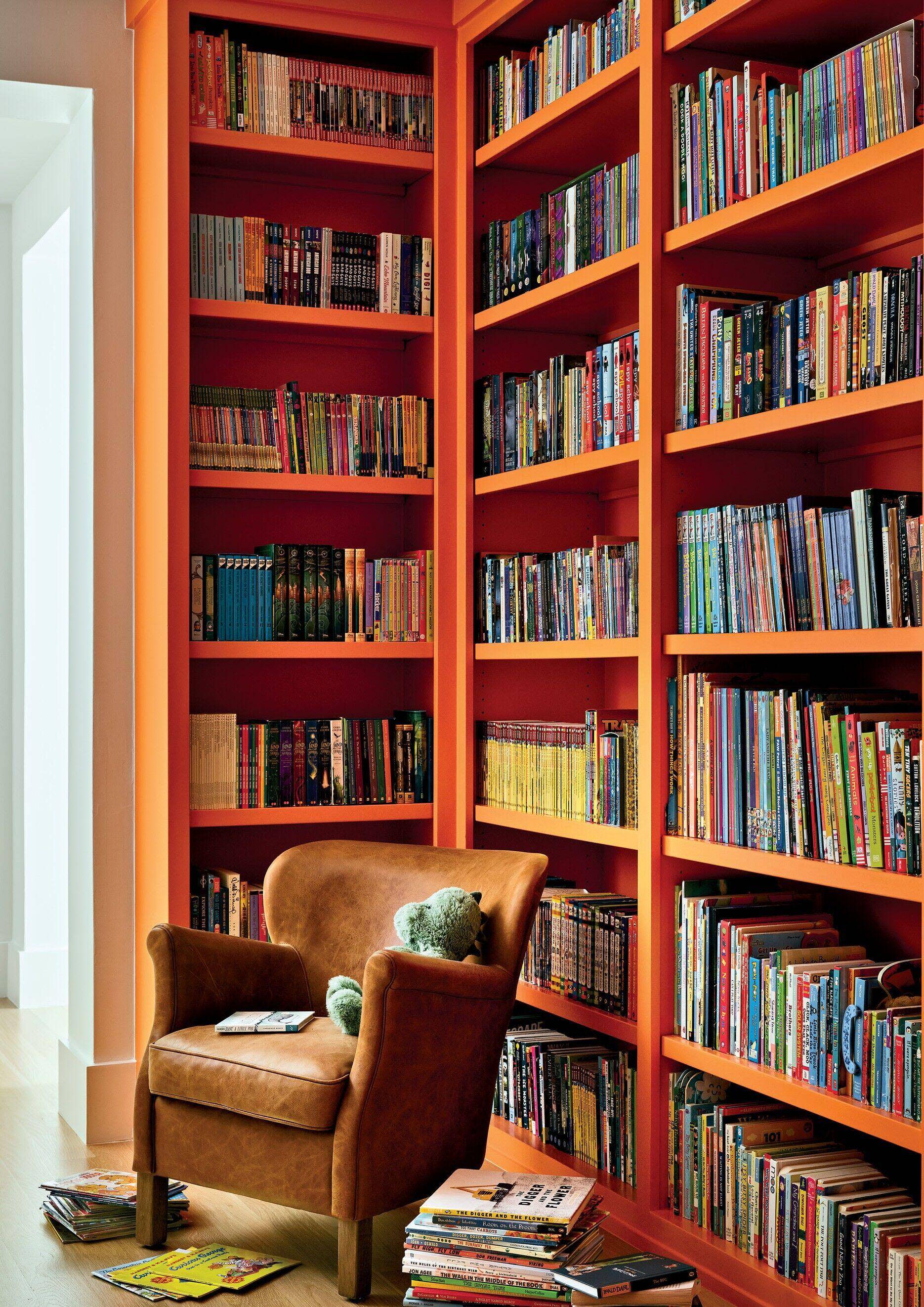 home library with bright orange shelves