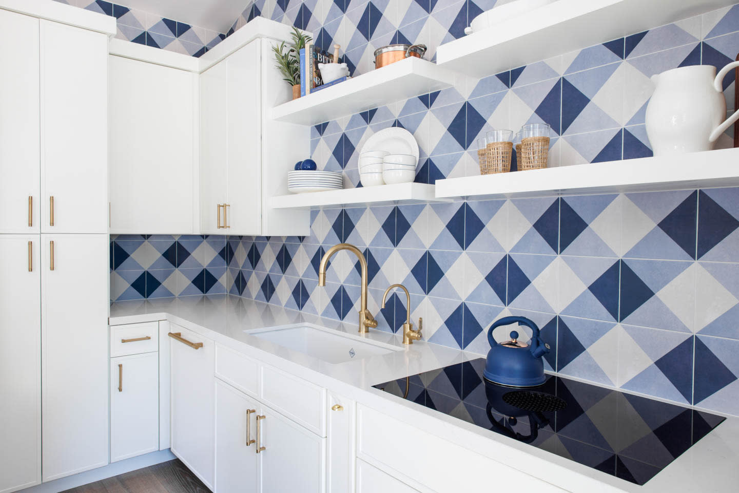 blue and white checkered tile in a kitchenette