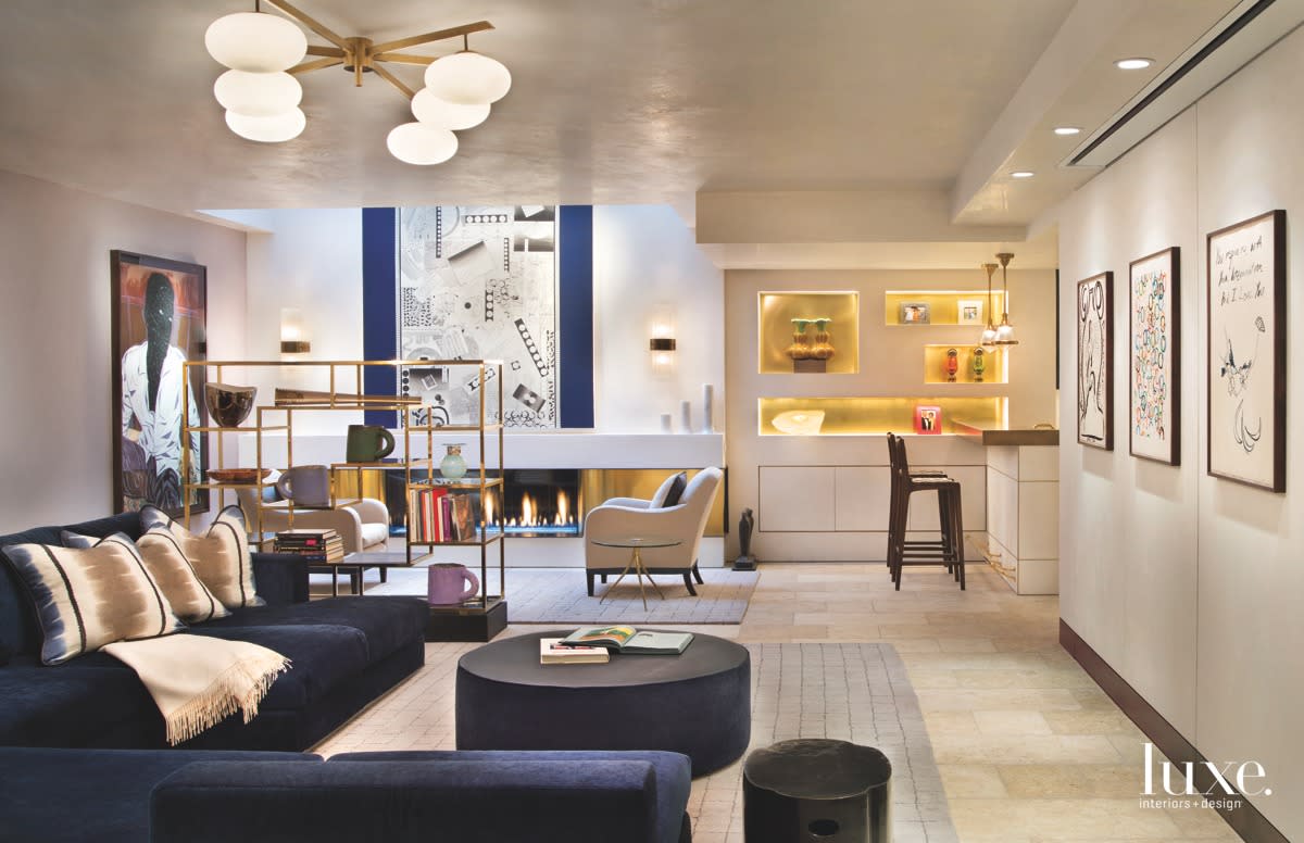 contemporary living room with navy sofa in an Aspen duplex