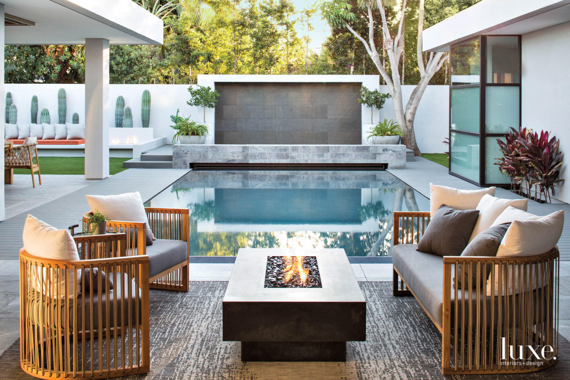 Seating area with fire pit looking toward pool