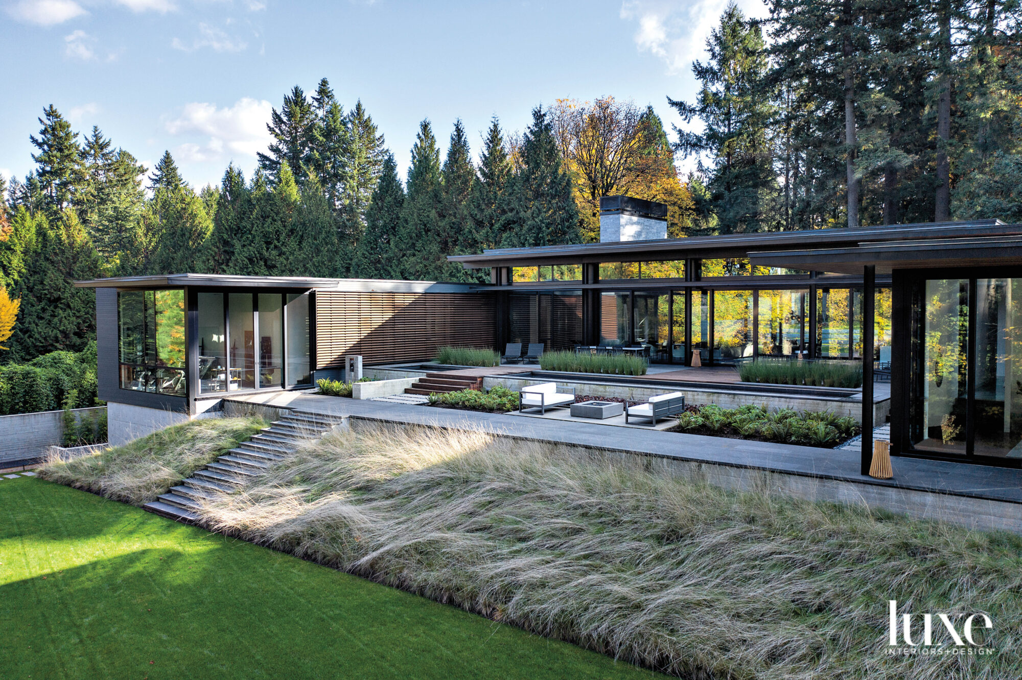 Home exterior with terrace and sweeping lawn