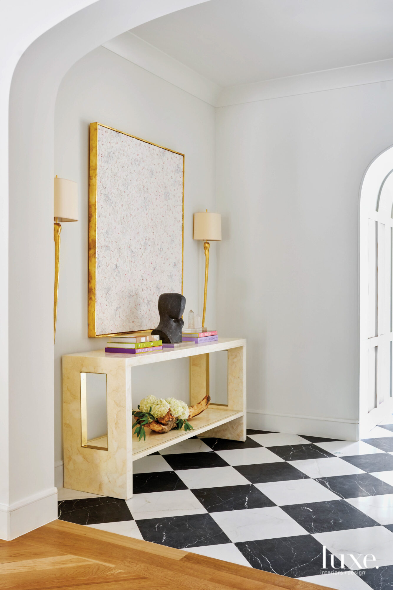 Entry with black-and-white checkerboard flooring.