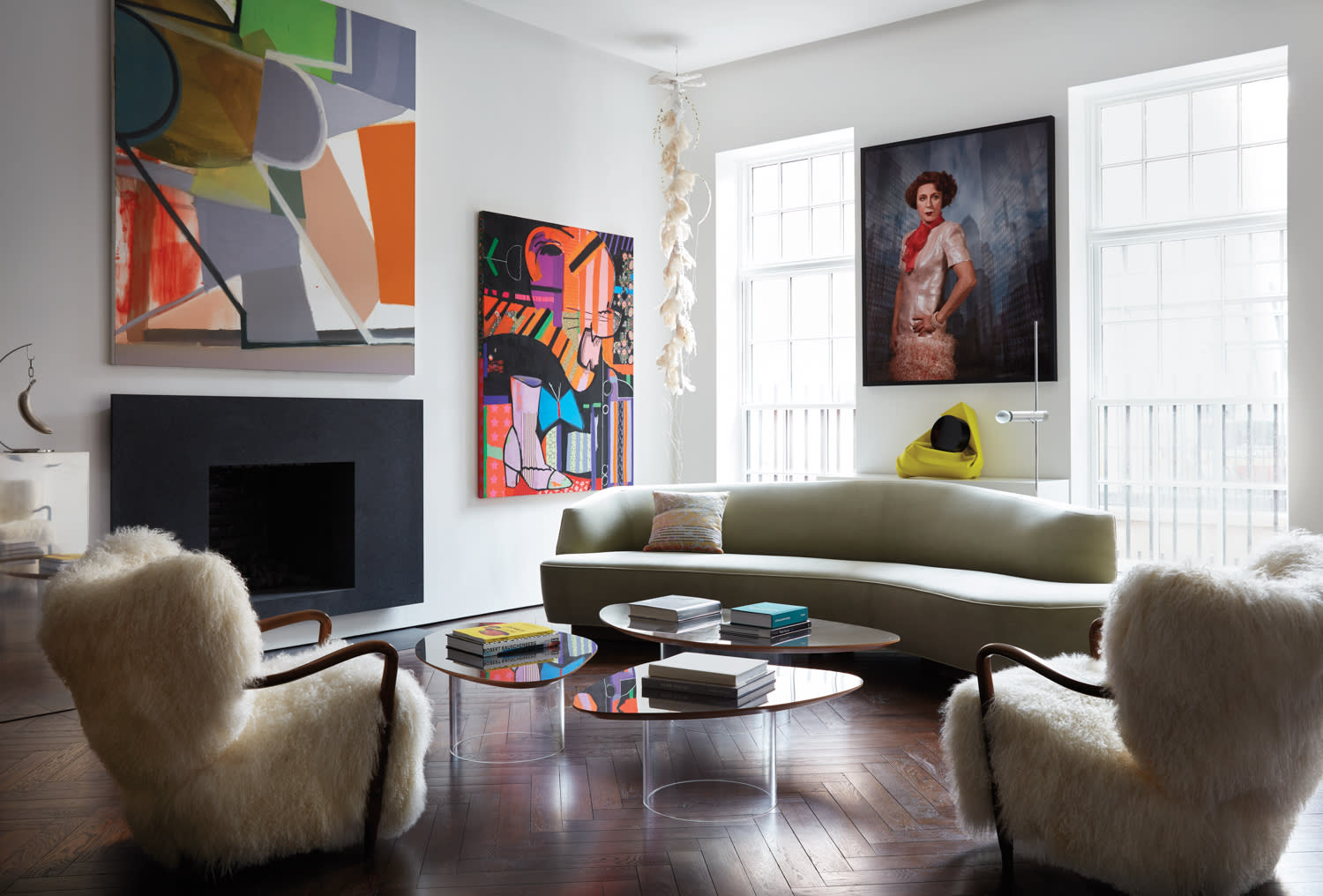 white living room with grey sofa and colorful artwork designed by Billy Cotton