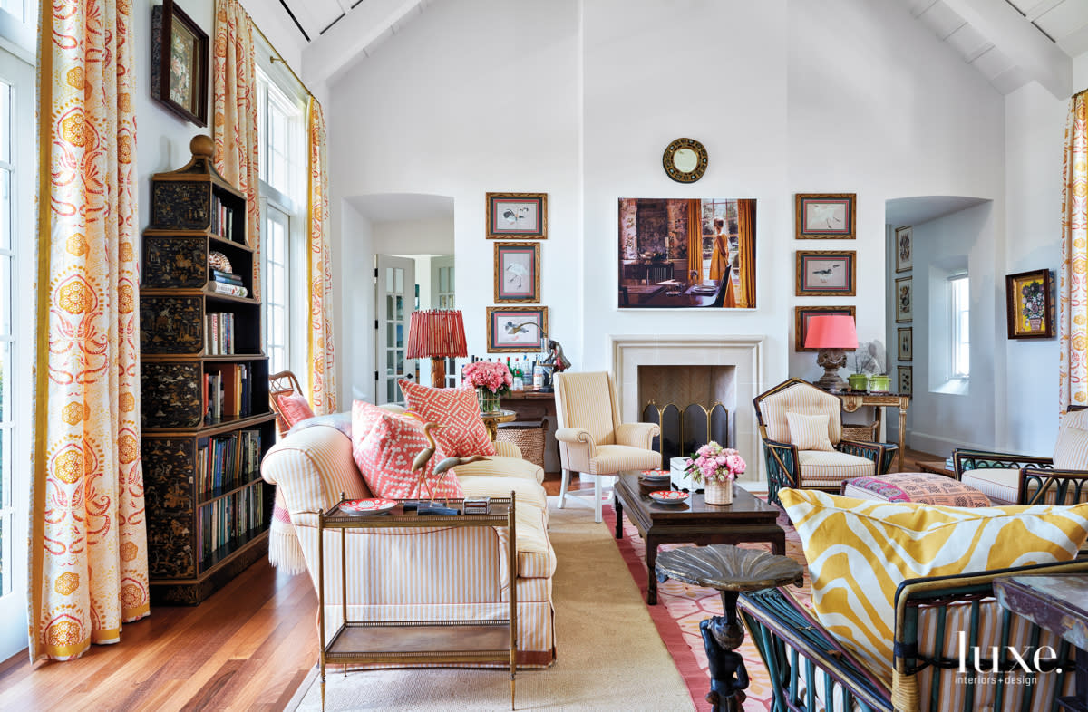 Neutral living room with pops of coral and orange
