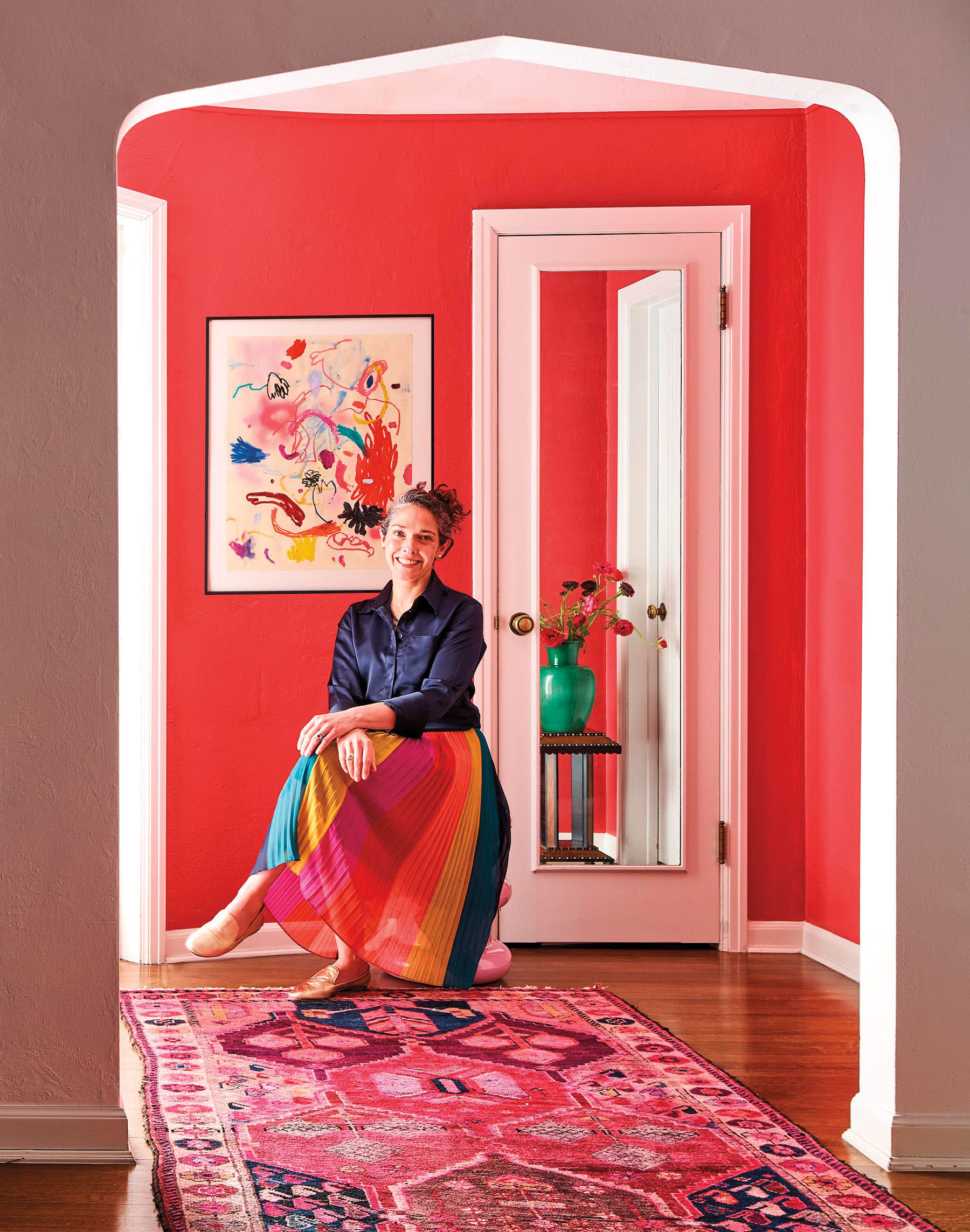 Nadia Watts poses in a pink room