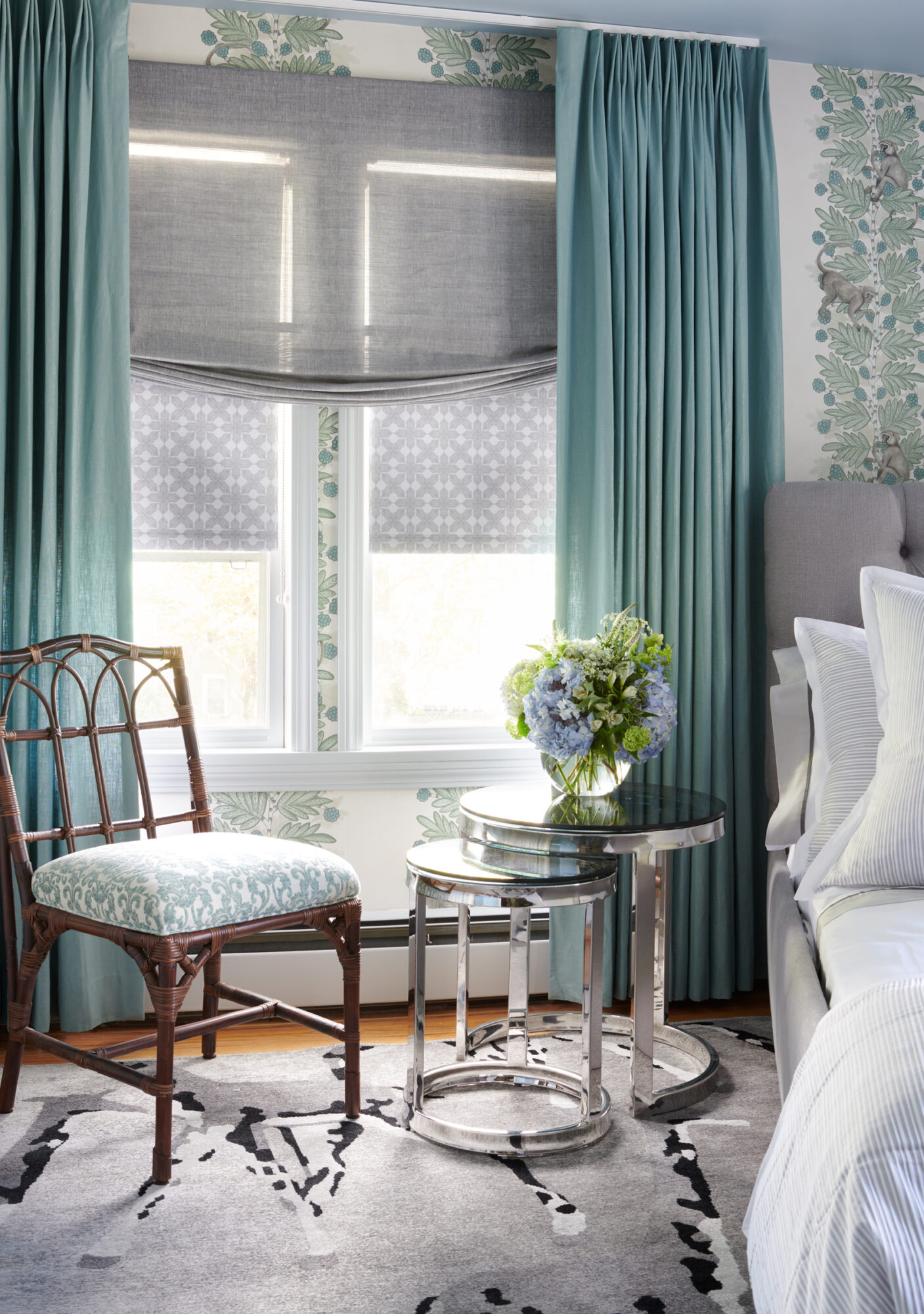 teal and gray bedroom with accent chair