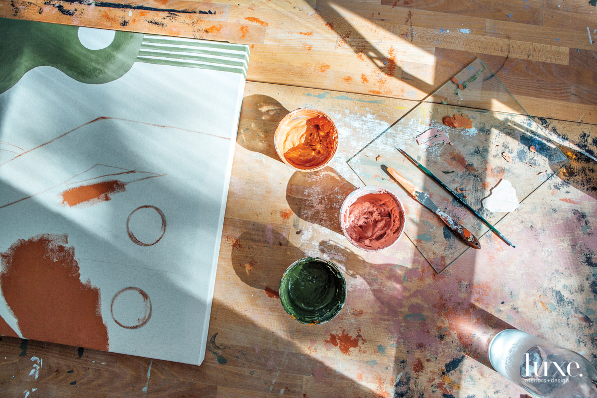 paints, diesel, and paint brushes on a glass palette