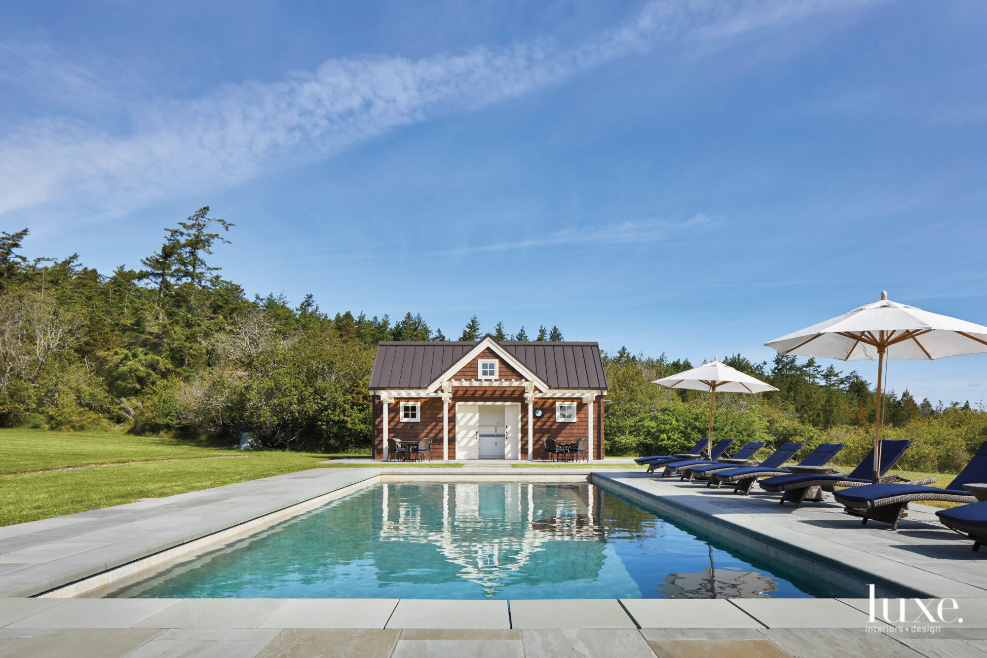 View looking toward pool and pool house